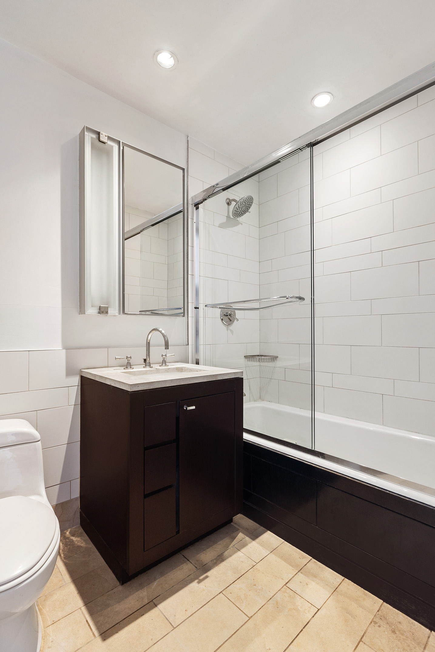 450 East 83rd Street, Unit 8B Manhattan, NY 10028 - Photo 12 of 22 a bathroom with a sink and a mirror