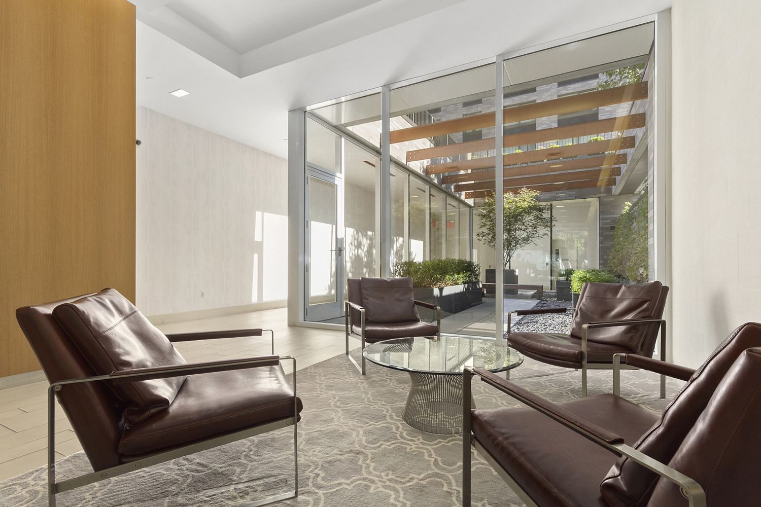23 West 116th Street, Unit 8A Manhattan, NY 10026 - Photo 26 of 28 a living room with furniture and floor to ceiling window