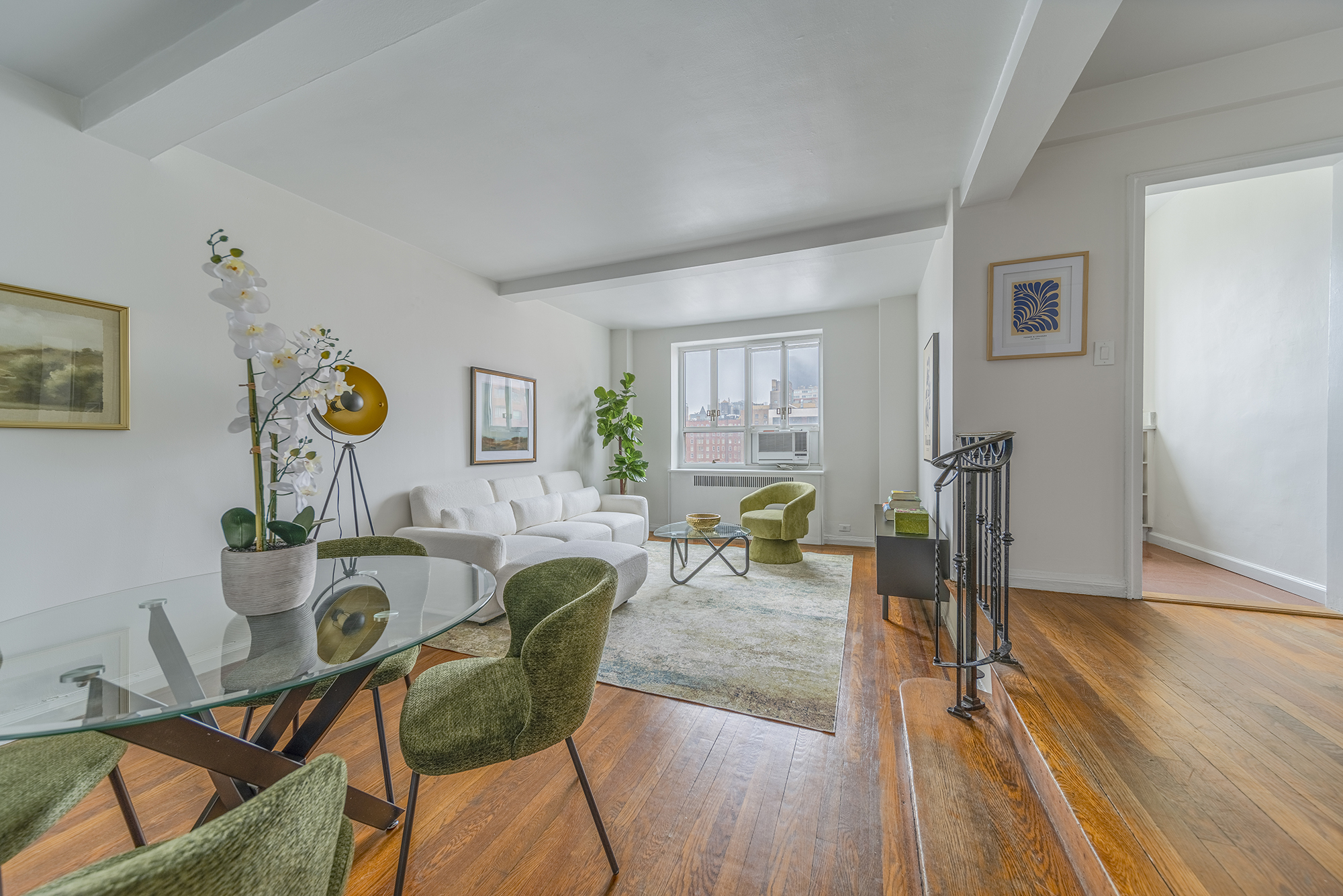200 West 20th Street, Unit 1208 Manhattan, NY 10011 - Photo 4 of 14 a living room with furniture and wooden floor