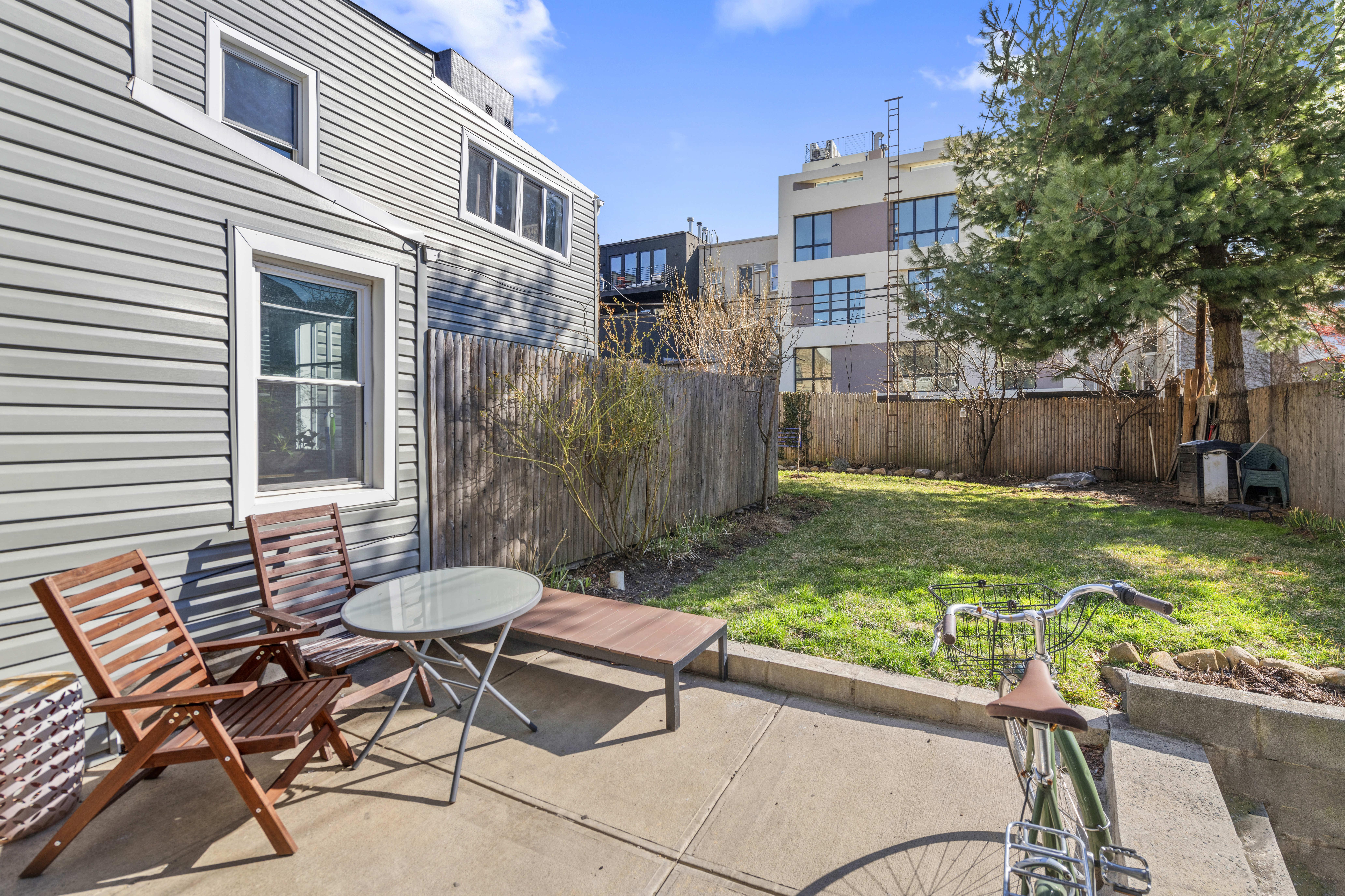 20 Devoe Street, Unit GF Brooklyn, NY 11211 - Photo 2 of 6 a view of a chairs and table in backyard of the house