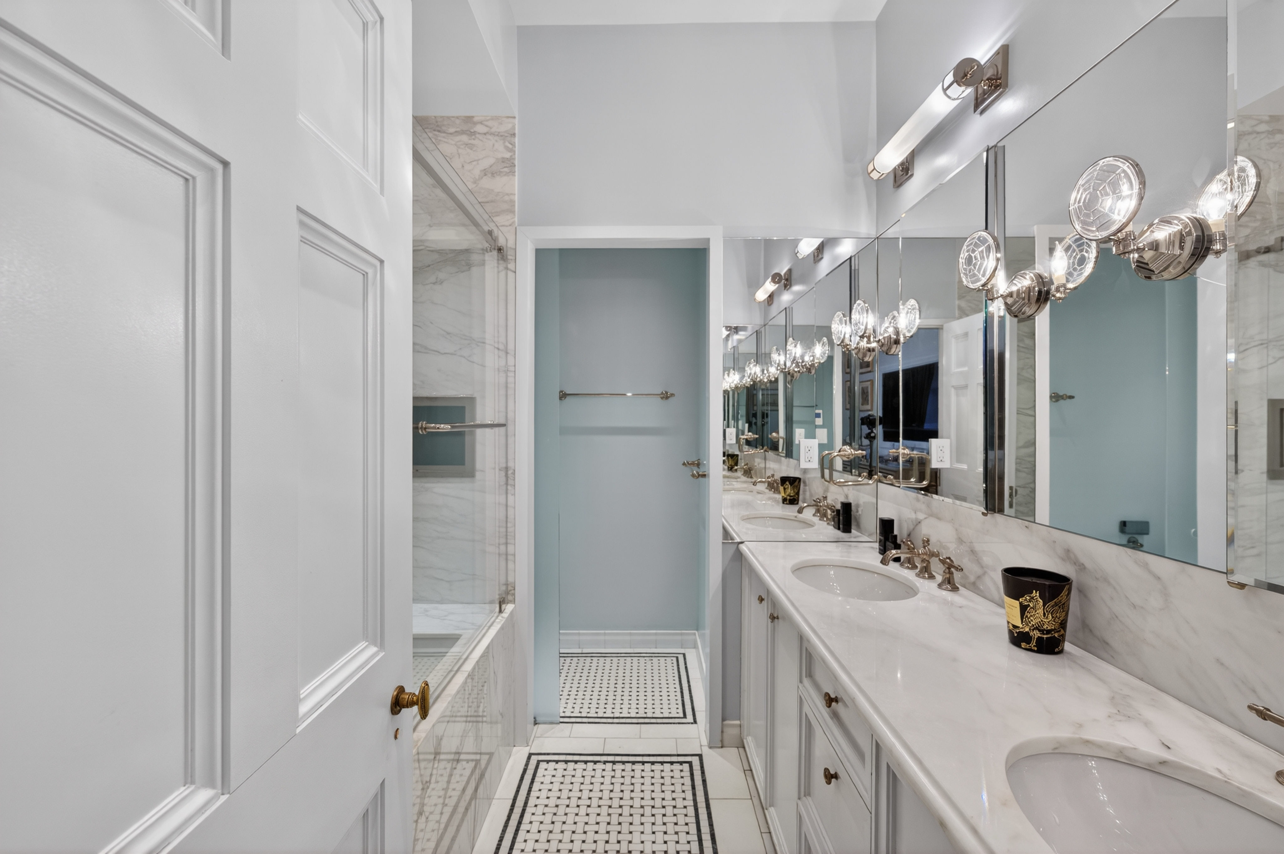 390 West End Avenue, Unit 11C Manhattan, NY 10024 - Photo 13 of 24 a bathroom with a sink a faucet a mirror and a shower