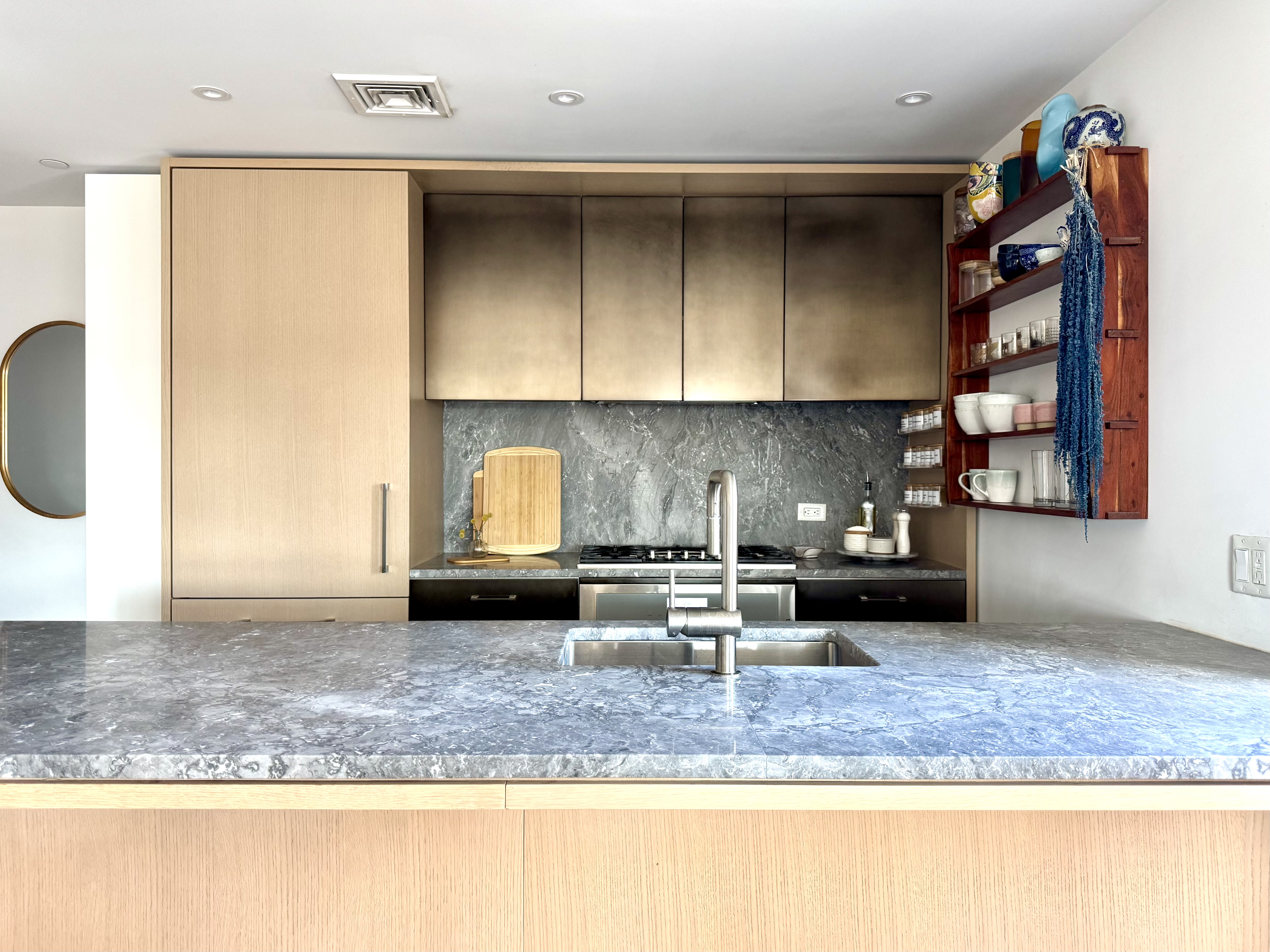 561 Pacific Street, Unit 803 Brooklyn, NY 11217 - Photo 2 of 16 a kitchen with a sink a counter and cabinets
