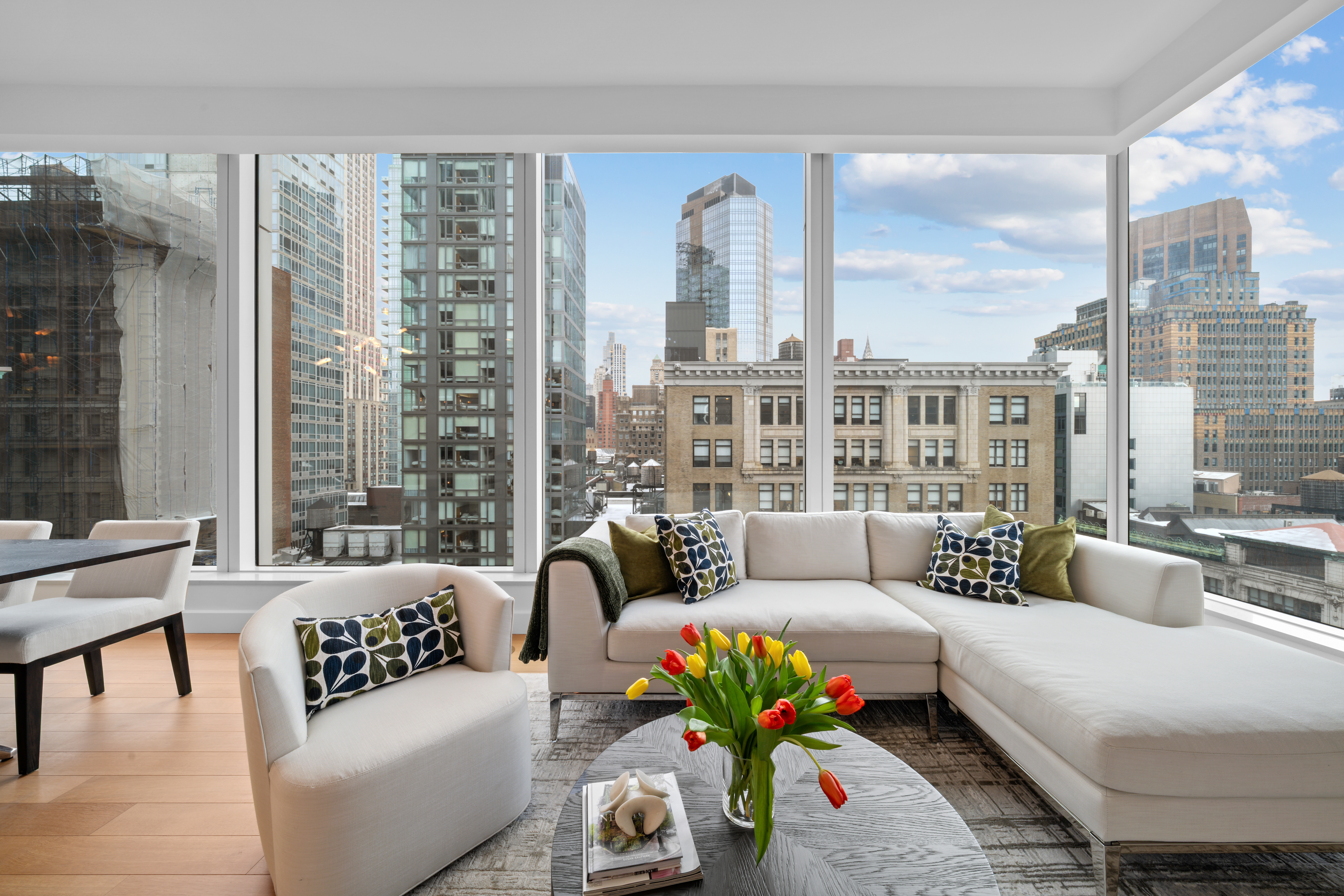 15 East 30th Street, Unit 19B Manhattan, NY 10016 - Photo 11 of 40 a living room with furniture and a large window