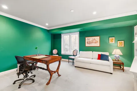 a workspace with furniture and window