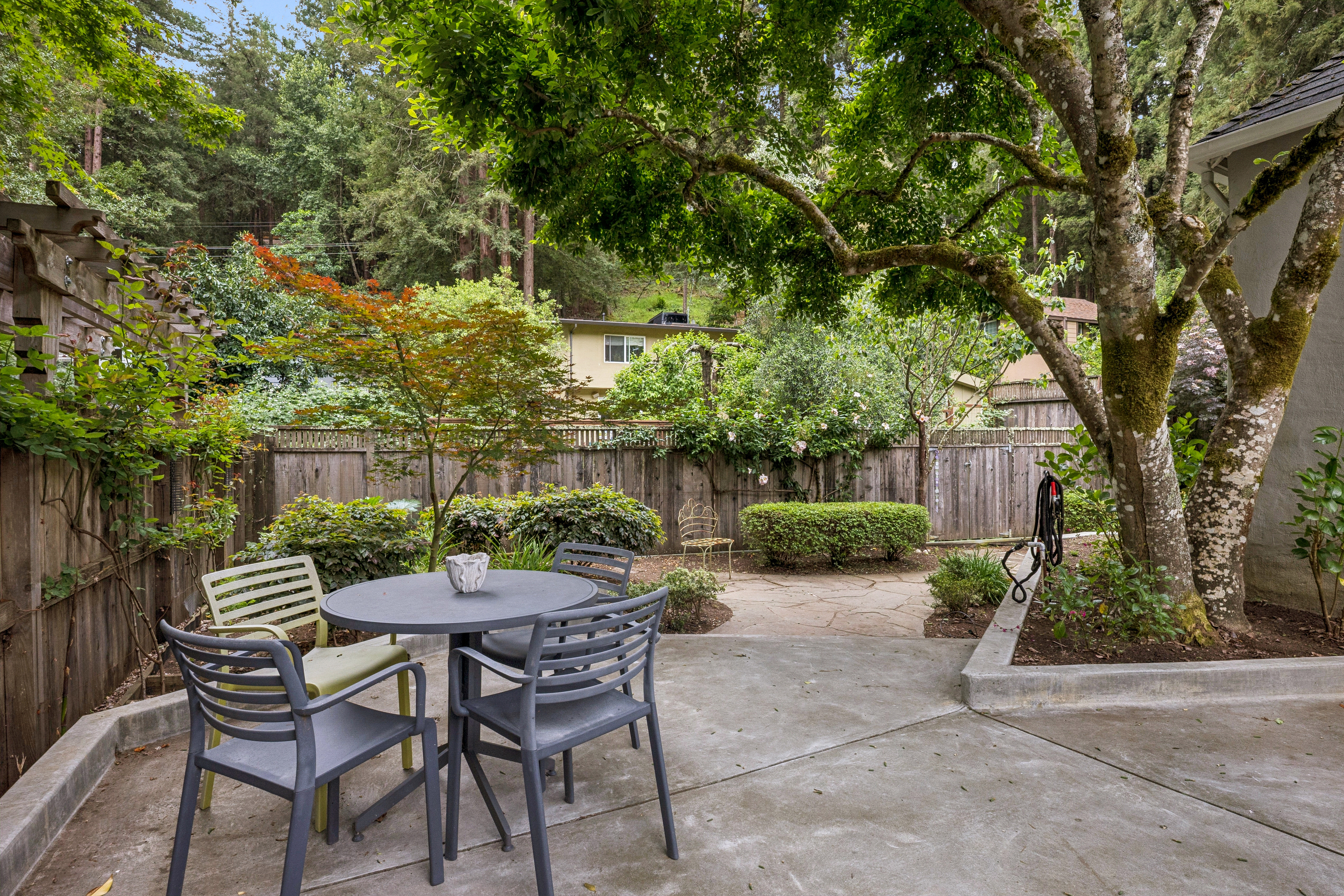 77 Bothin Road Fairfax, CA 94930 - Photo 28 of 32 a view of a chairs and table in backyard of the house