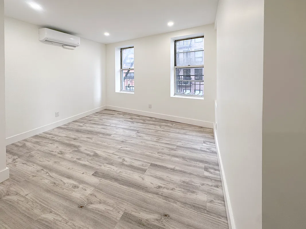 55 Spring Street, Unit 7 Manhattan, NY 10012 - Photo 5 of 12 a view of an empty room and a window