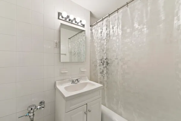 a bathroom with a sink and mirror