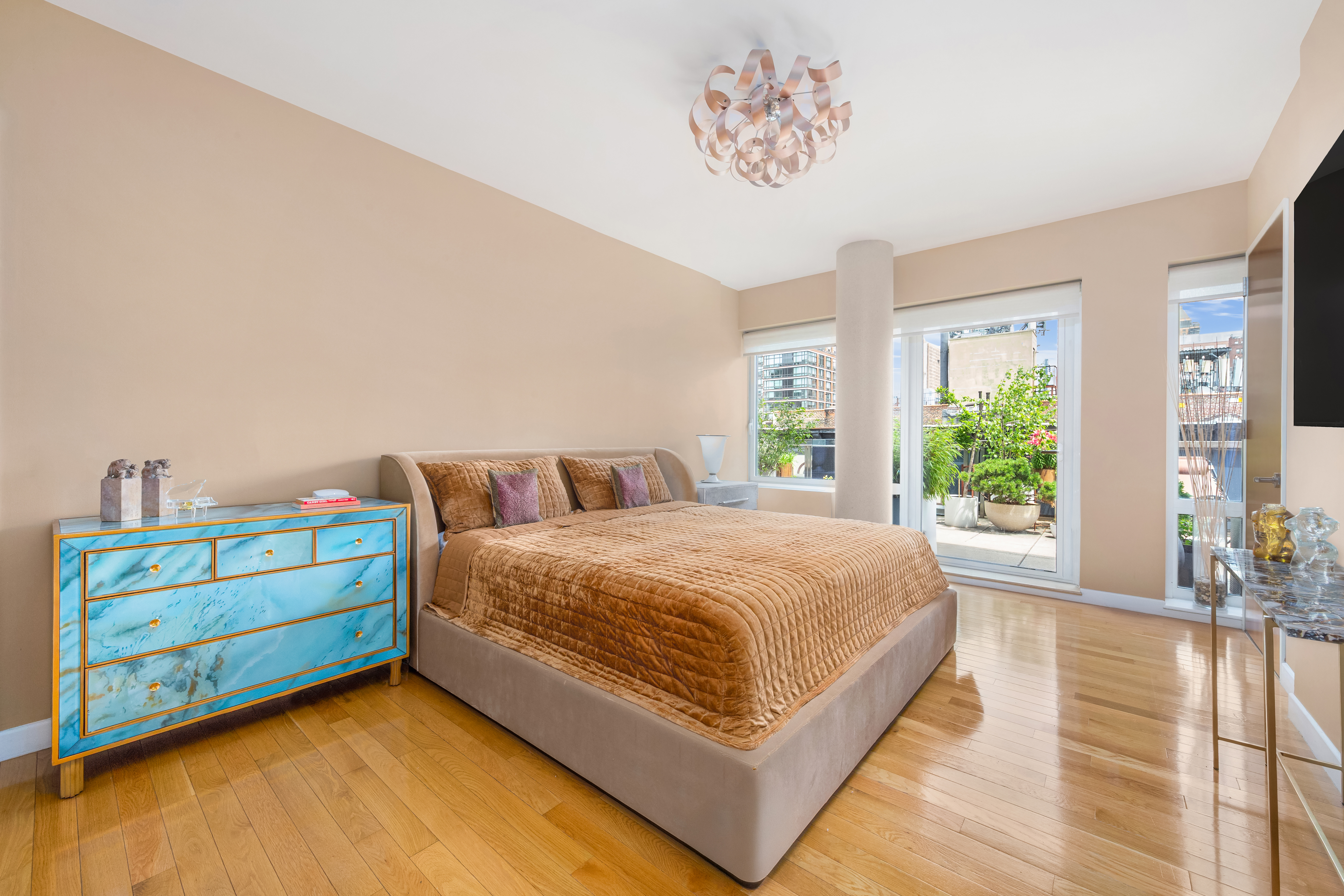 454 West 54th Street, Unit 7B Manhattan, NY 10019 - Photo 6 of 15 a bedroom with a bed and a large window