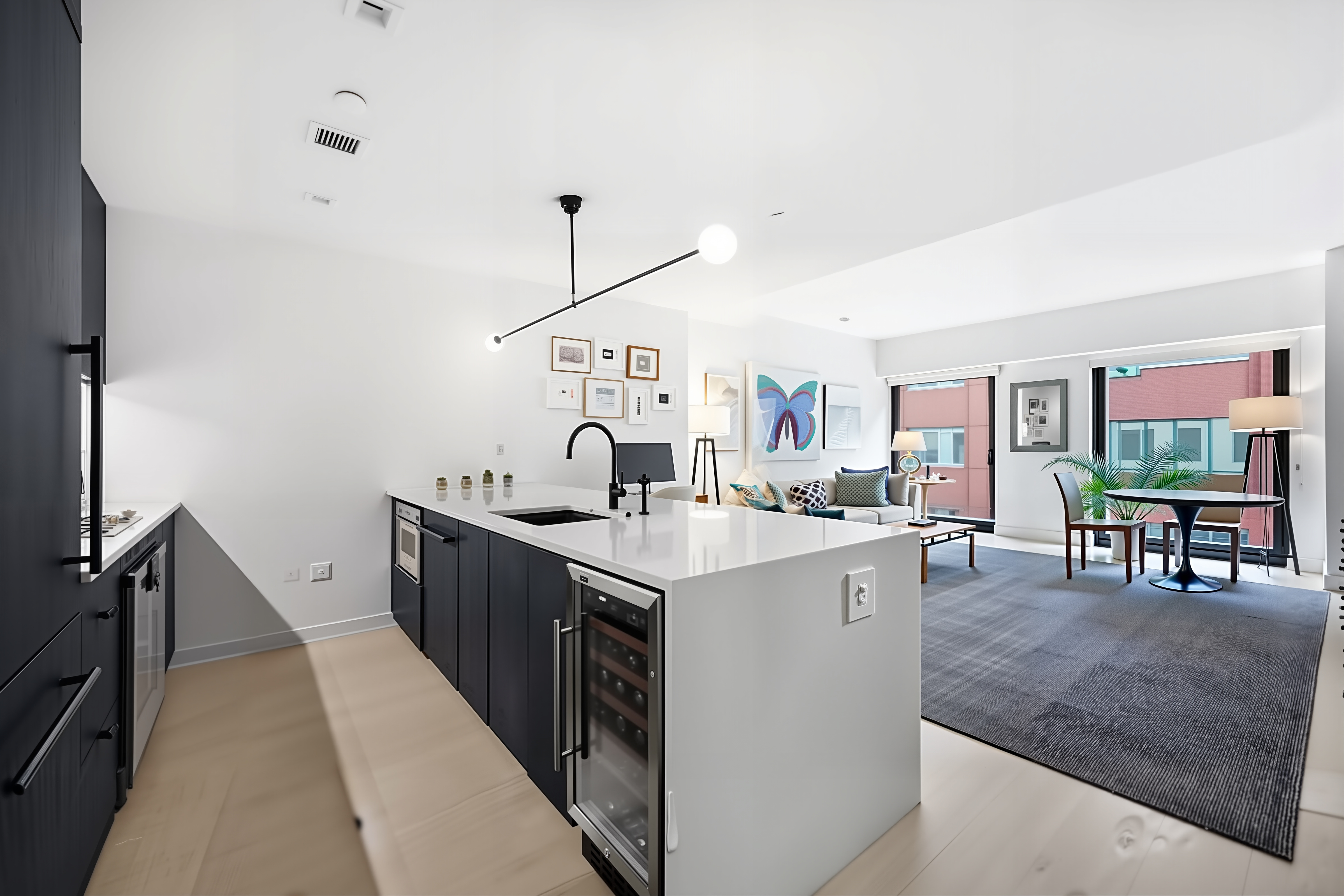 55 West 17th Street, Unit 502 Manhattan, NY 10011 - Photo 2 of 6 a kitchen with white cabinets and sink