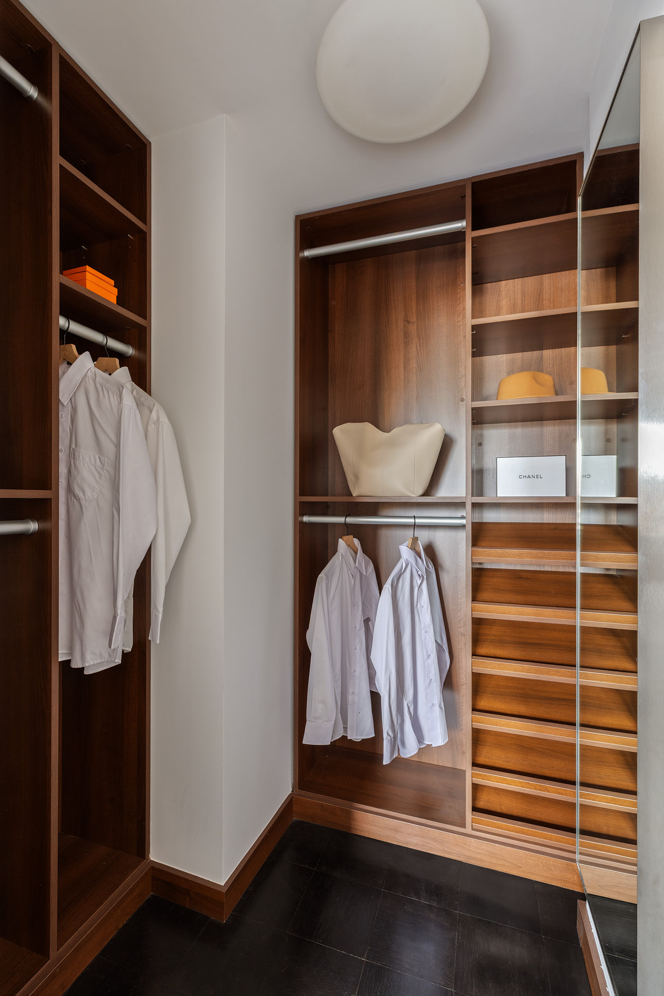 31 Jane Street, Unit 16G Manhattan, NY 10014 - Photo 15 of 20 a view of walk in closet with clothes and shoes