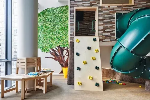 a living room with furniture cabinets and a book shelf