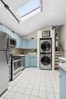 a kitchen with a stove top oven and cabinets