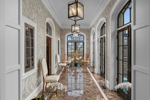 a view of a hallway with windows