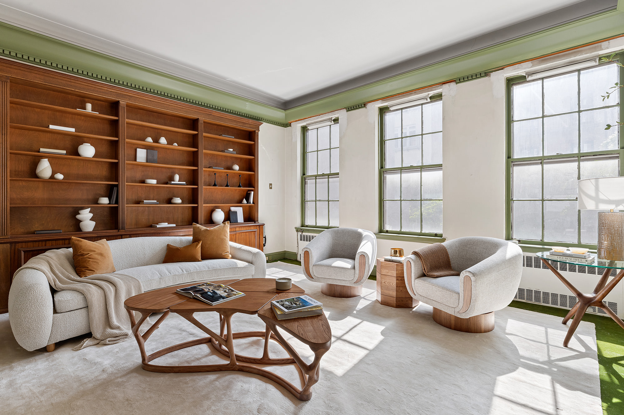 10 East 82nd Street Manhattan, NY 10028 - Photo 5 of 22 a living room with furniture and a floor to ceiling window