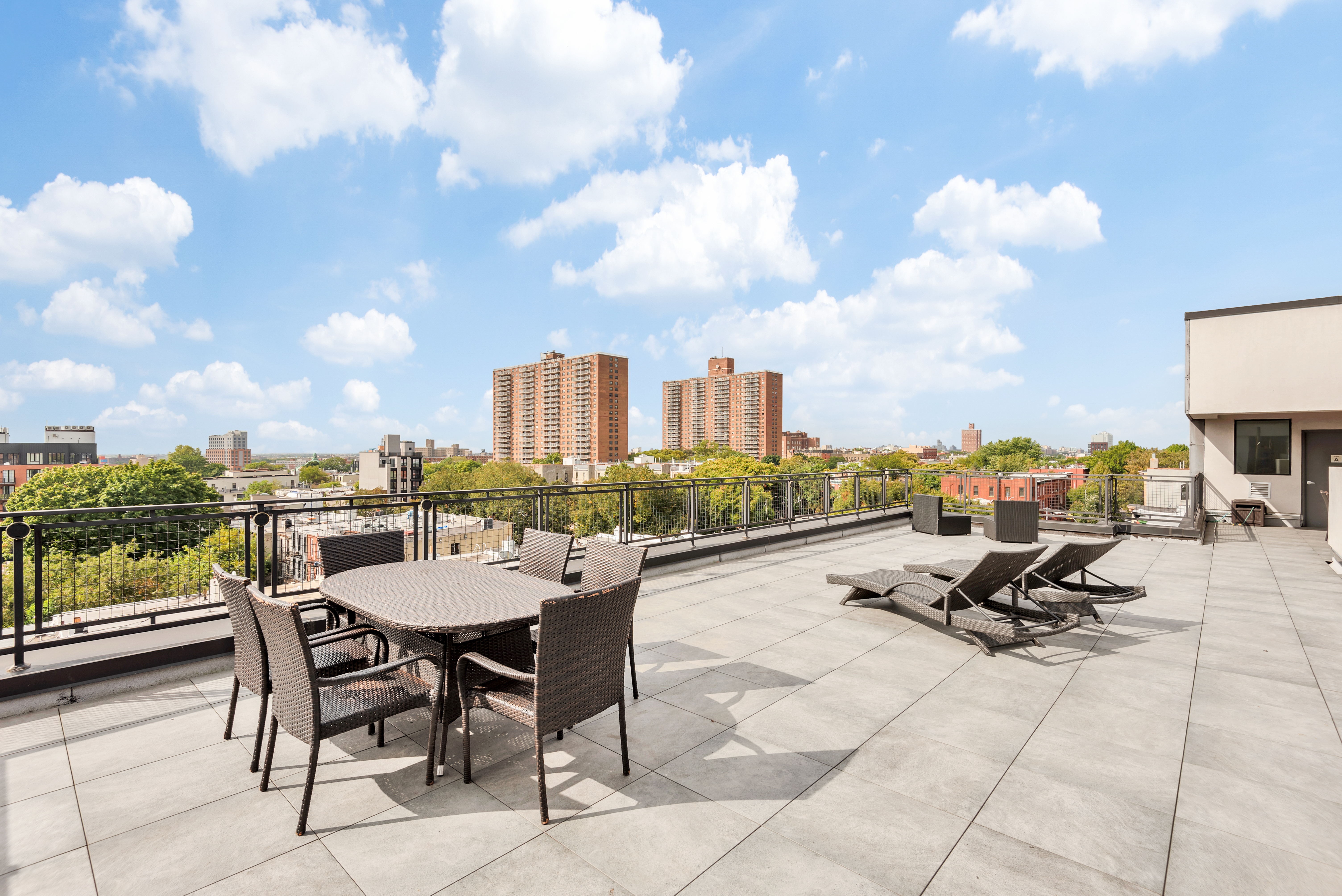 1325 Herkimer Street, Unit 404 Brooklyn, NY 11233 - Photo 5 of 6 a view of a terrace with furniture and a potted plant