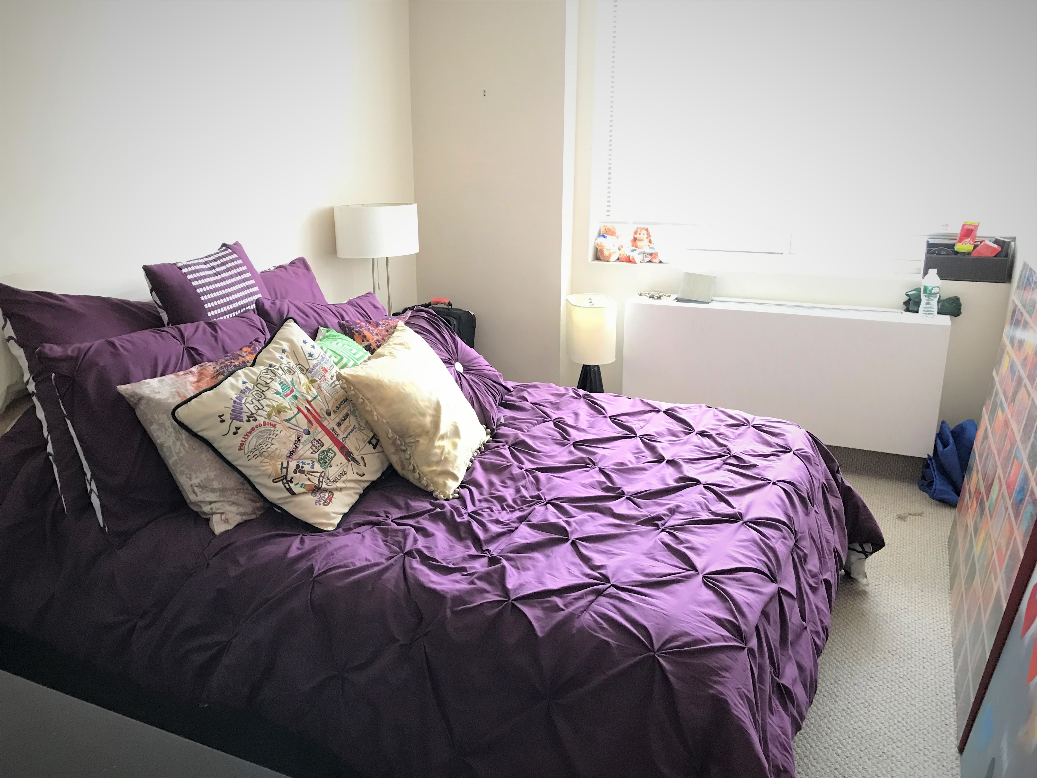 50 Lexington Avenue, Unit 9F Manhattan, NY 10010 - Photo 3 of 7 a bedroom with a bed and a window