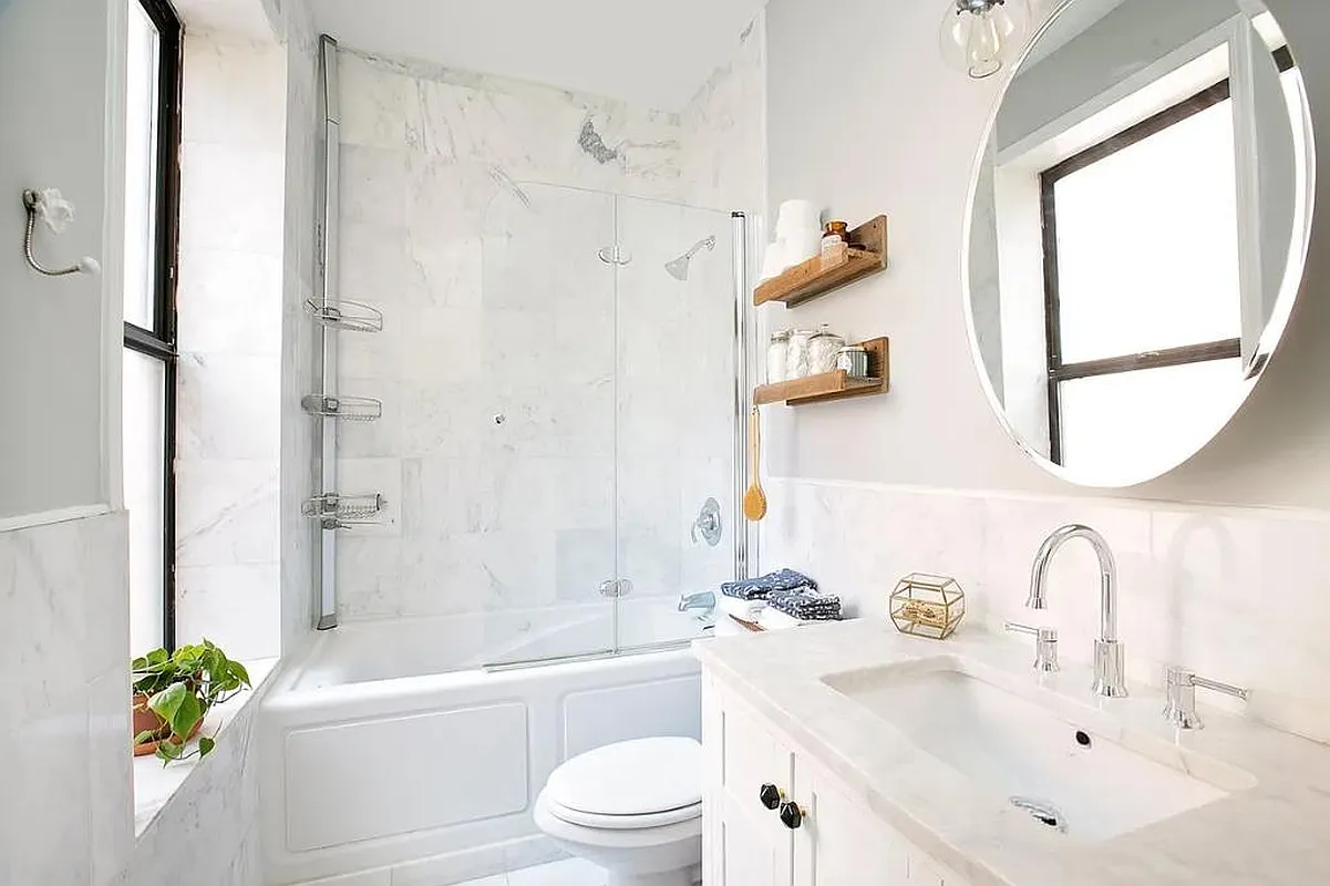 314 West 94th Street, Unit 5E Manhattan, NY 10025 - Photo 2 of 9 a bathroom with a sink a toilet and a bathtub