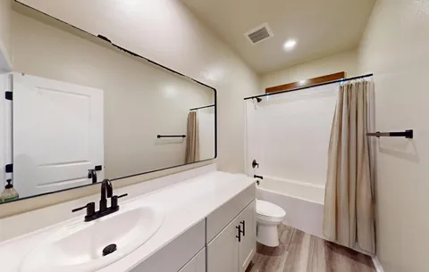 an aerial view of a house with swimming pool