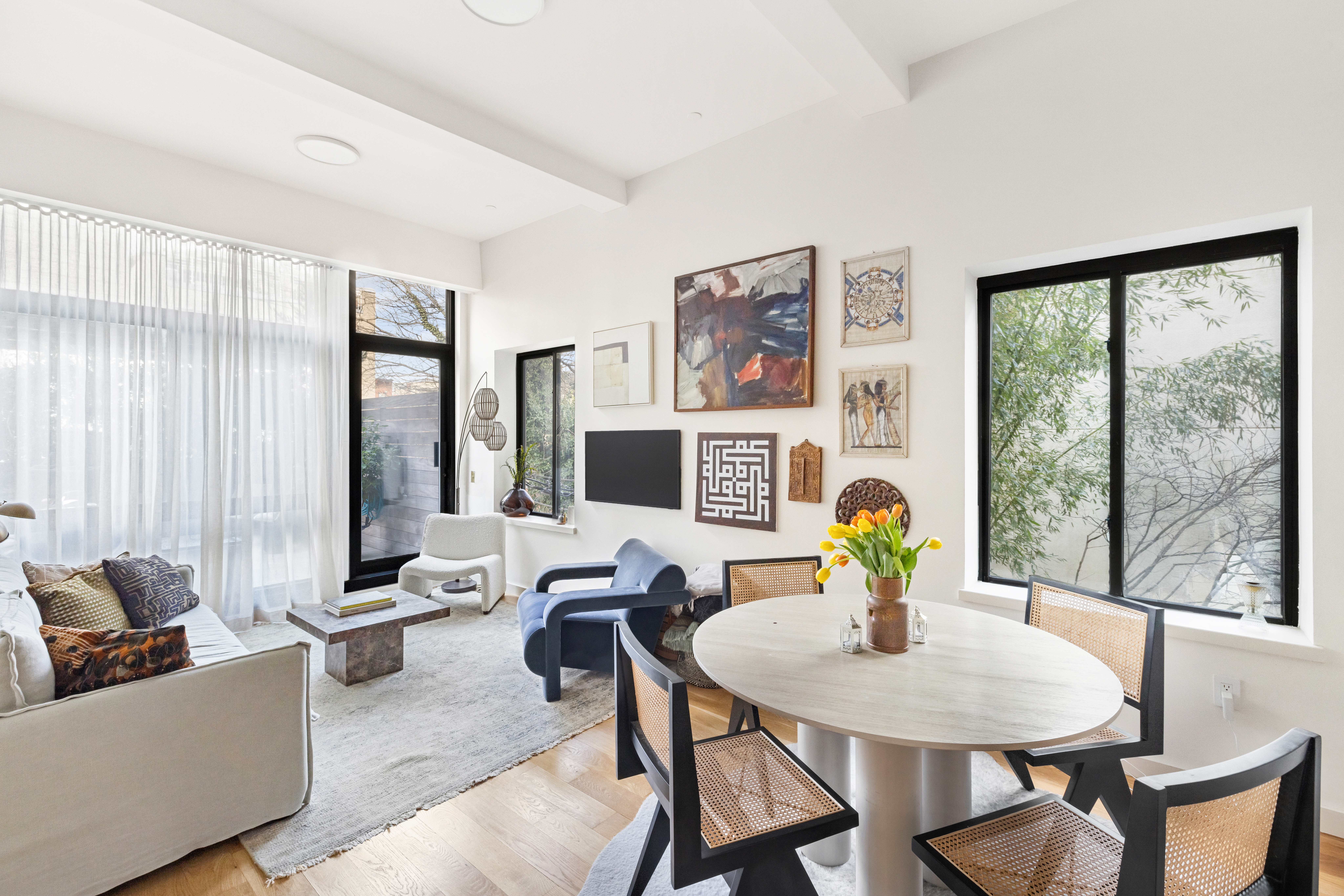 735 Dean Street, Unit 2B Brooklyn, NY 11238 - Photo 2 of 11 a living room with furniture and a table