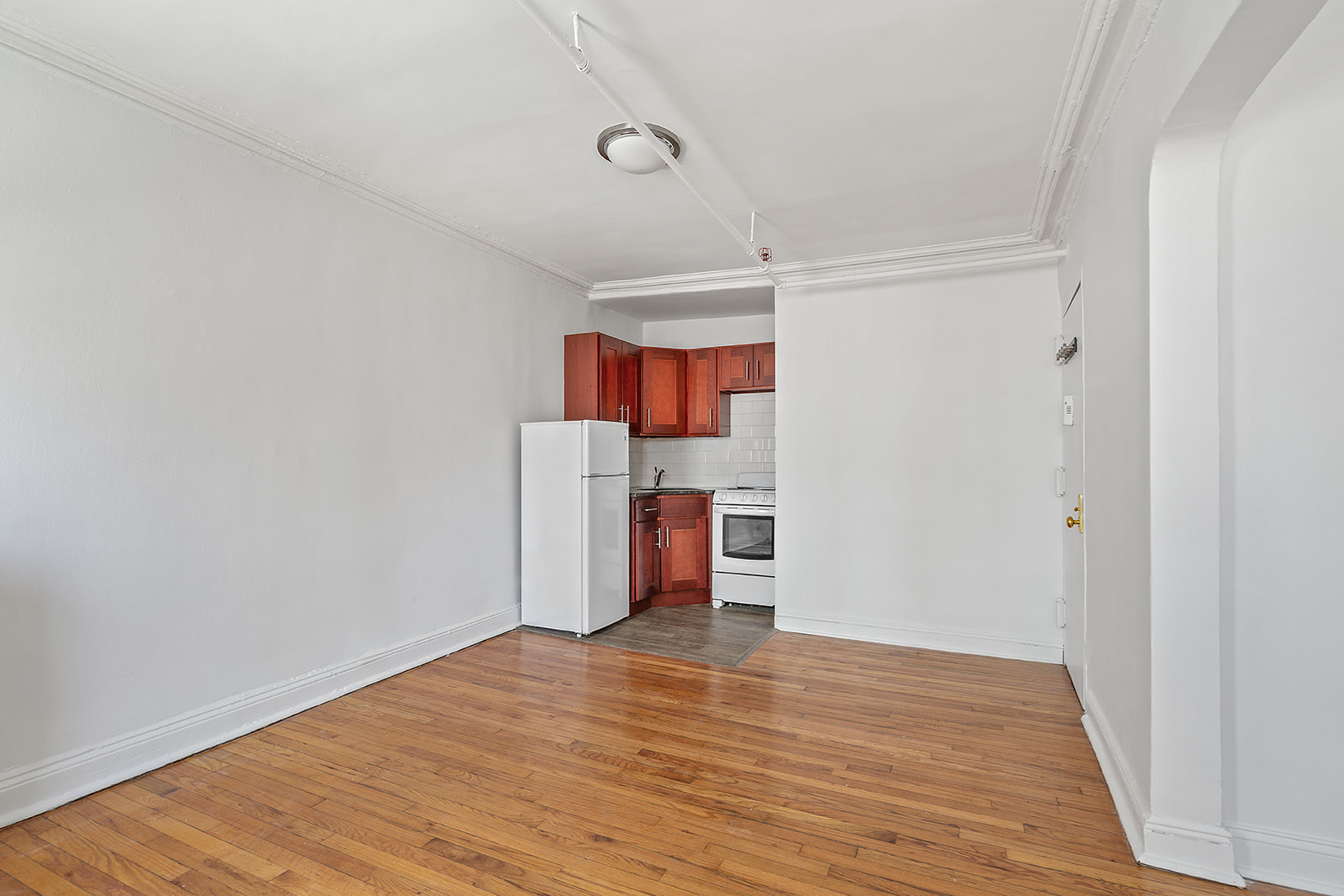 544 Pacific Street Brooklyn, NY 11217 - Photo 10 of 15 a view of a kitchen with wooden floor