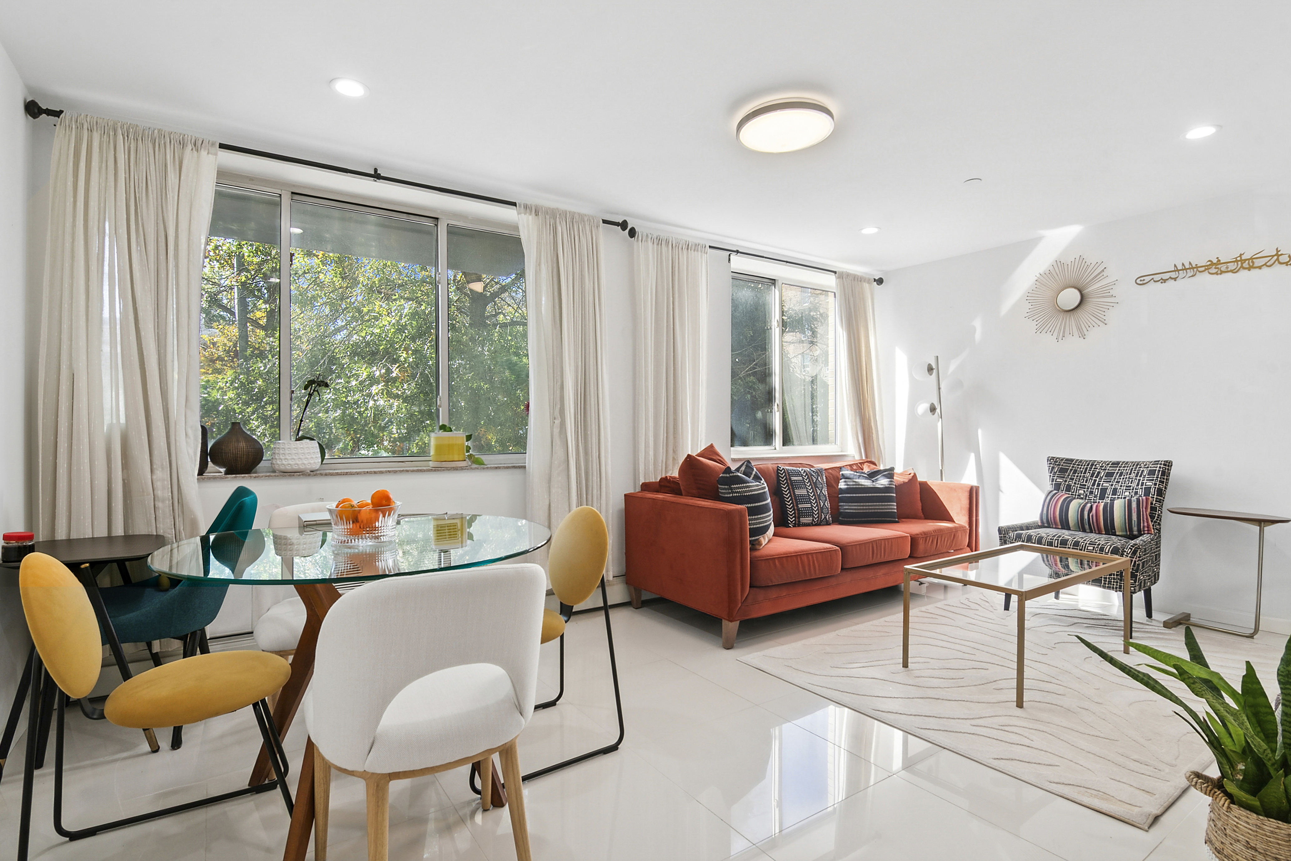 145 Kenilworth Place, Unit 2A Brooklyn, NY 11210 - Photo 1 of 7 a living room with furniture and a large window