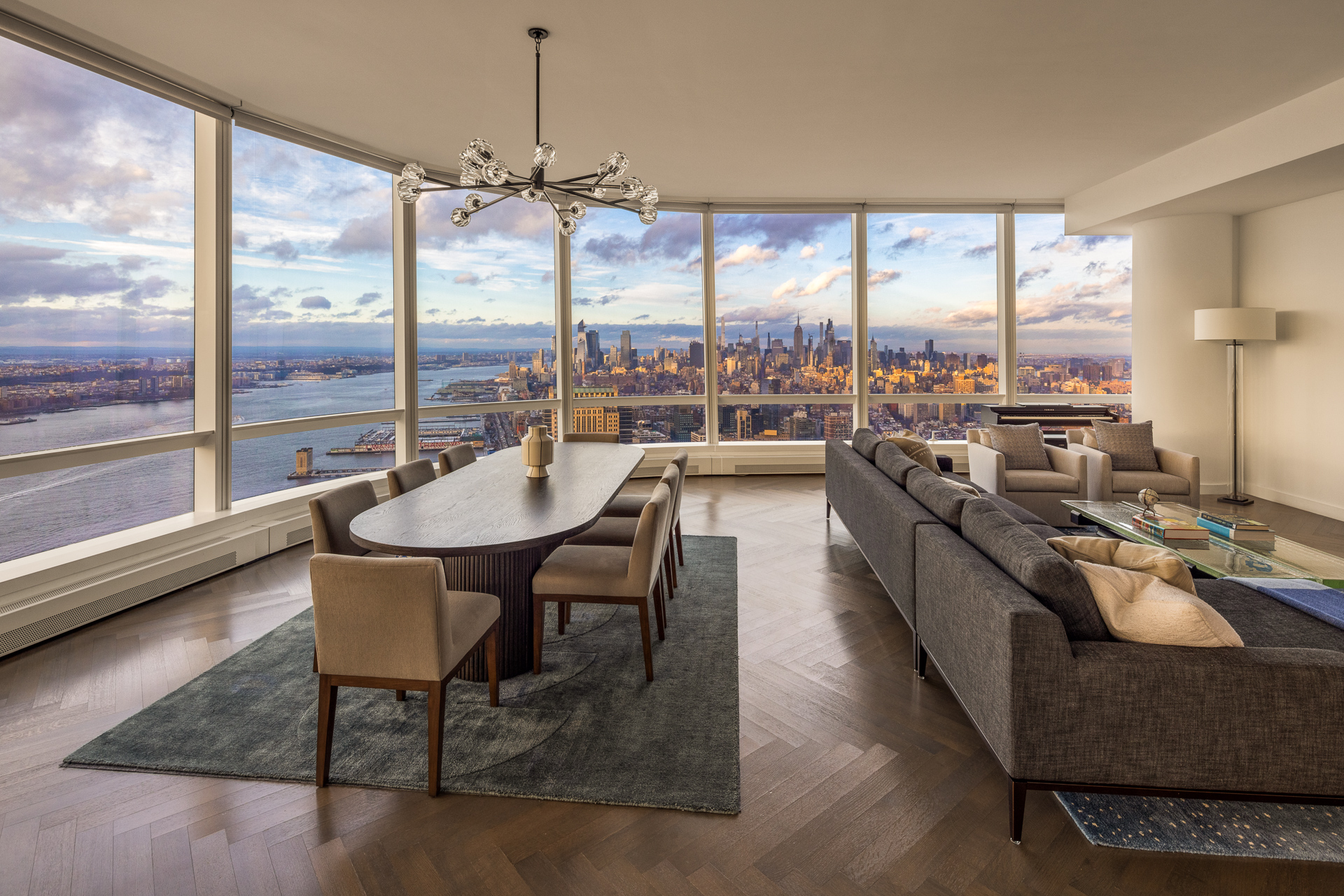 111 Murray Street, Unit 61W Manhattan, NY 10007 - Photo 16 of 35 a dining room with furniture a chandelier and wooden floor