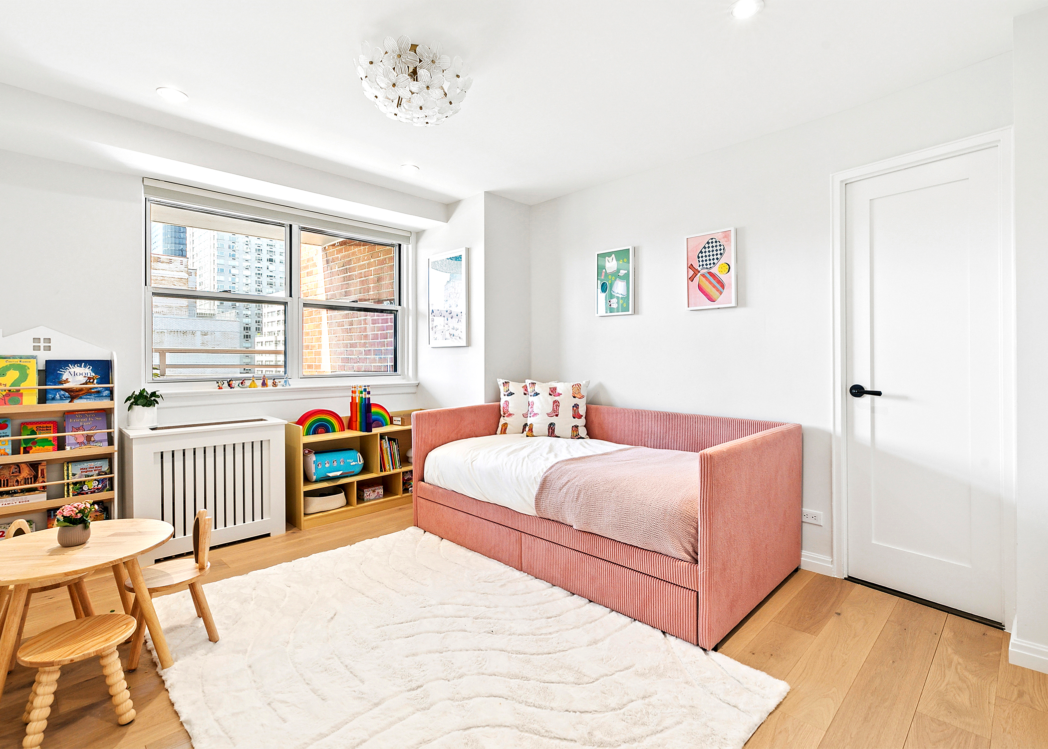 300 East 71st Street, Unit 17DEF Manhattan, NY 10021 - Photo 10 of 16 a bedroom with a bed and a table in it