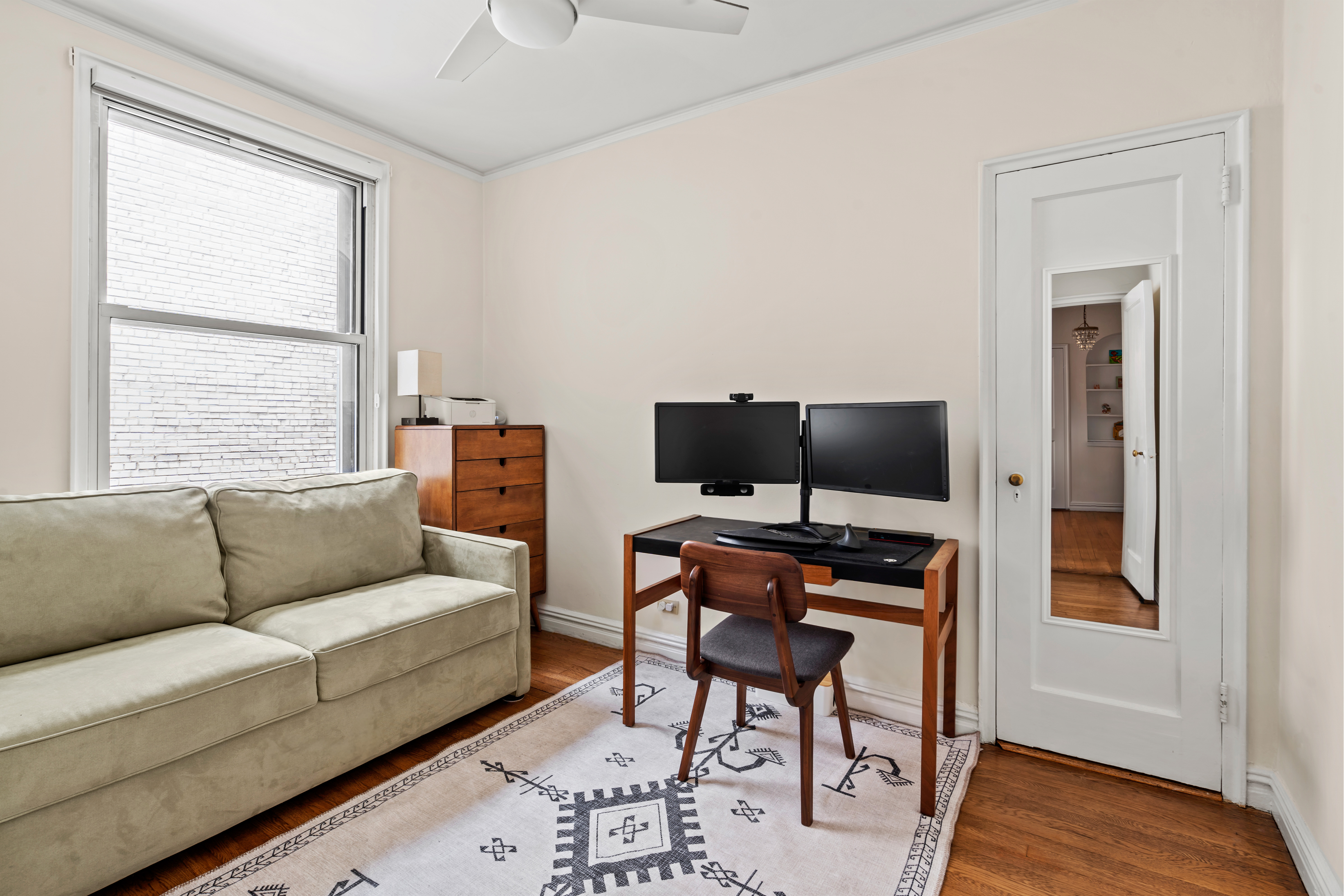 225 West 25th Street, Unit 5D Manhattan, NY 10001 - Photo 7 of 16 a living room with furniture and a flat screen tv