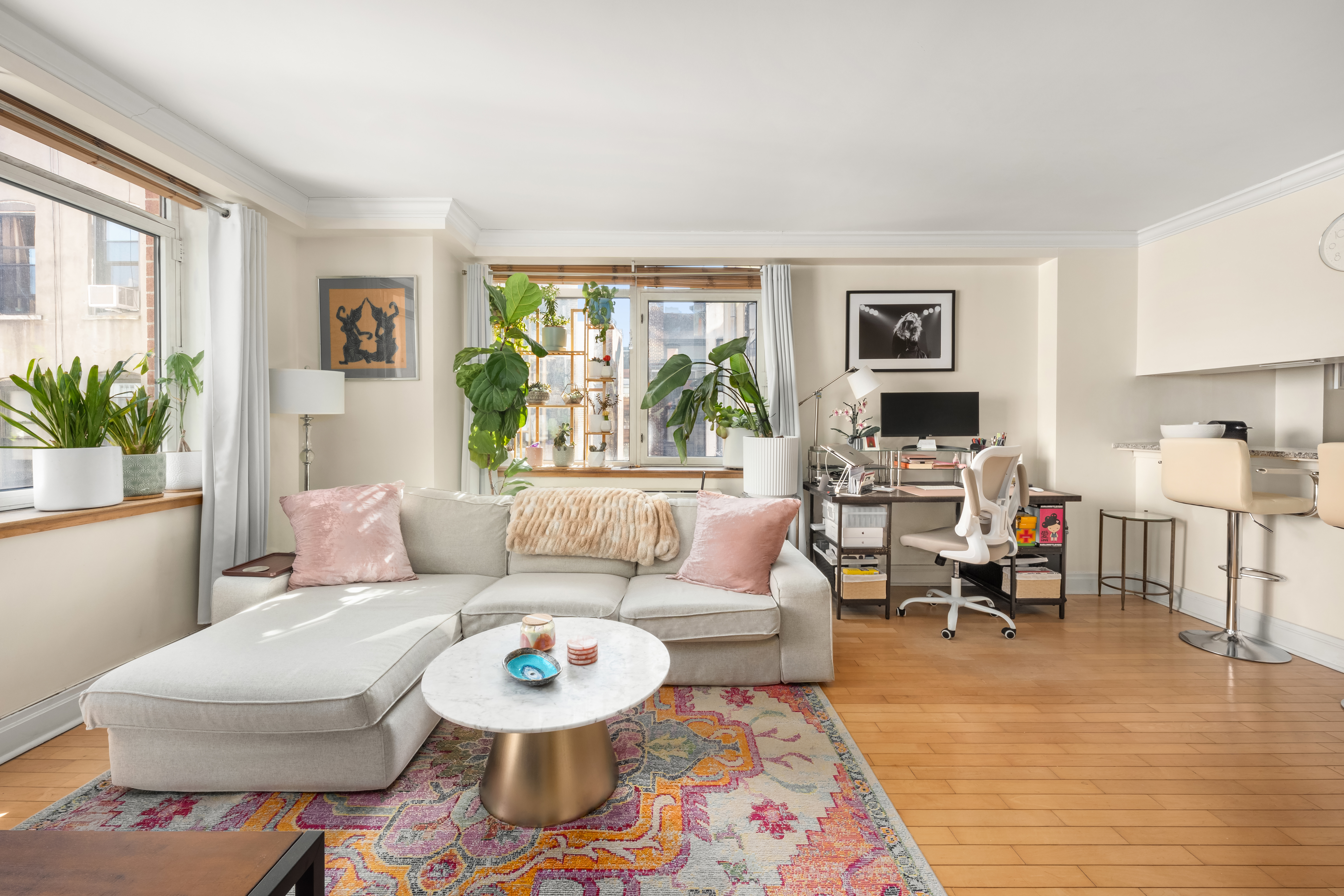 1760 2nd Avenue, Unit 5E Manhattan, NY 10128 - Photo 2 of 6 a living room with furniture and a large window