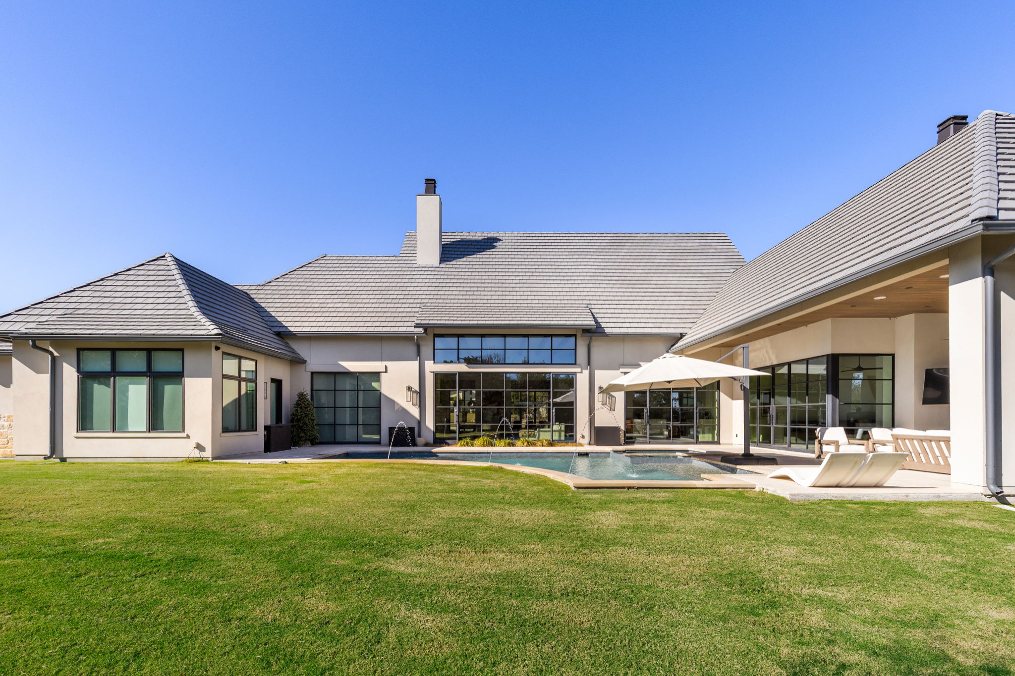 522 Delayne Drive Austin, TX 78737 - Photo 7 of 23 a front view of a house with a yard table and chairs