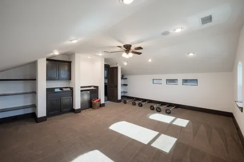 a kitchen with granite countertop a sink and cabinets