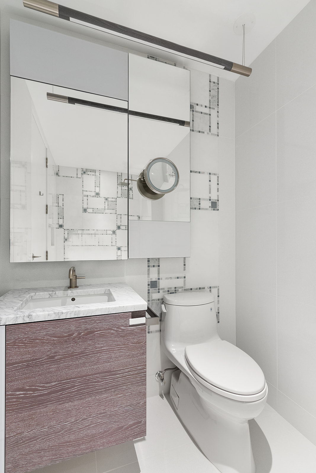1 City Point, Unit 36D Brooklyn, NY 11201 - Photo 4 of 16 a bathroom with a granite countertop sink a toilet and shower
