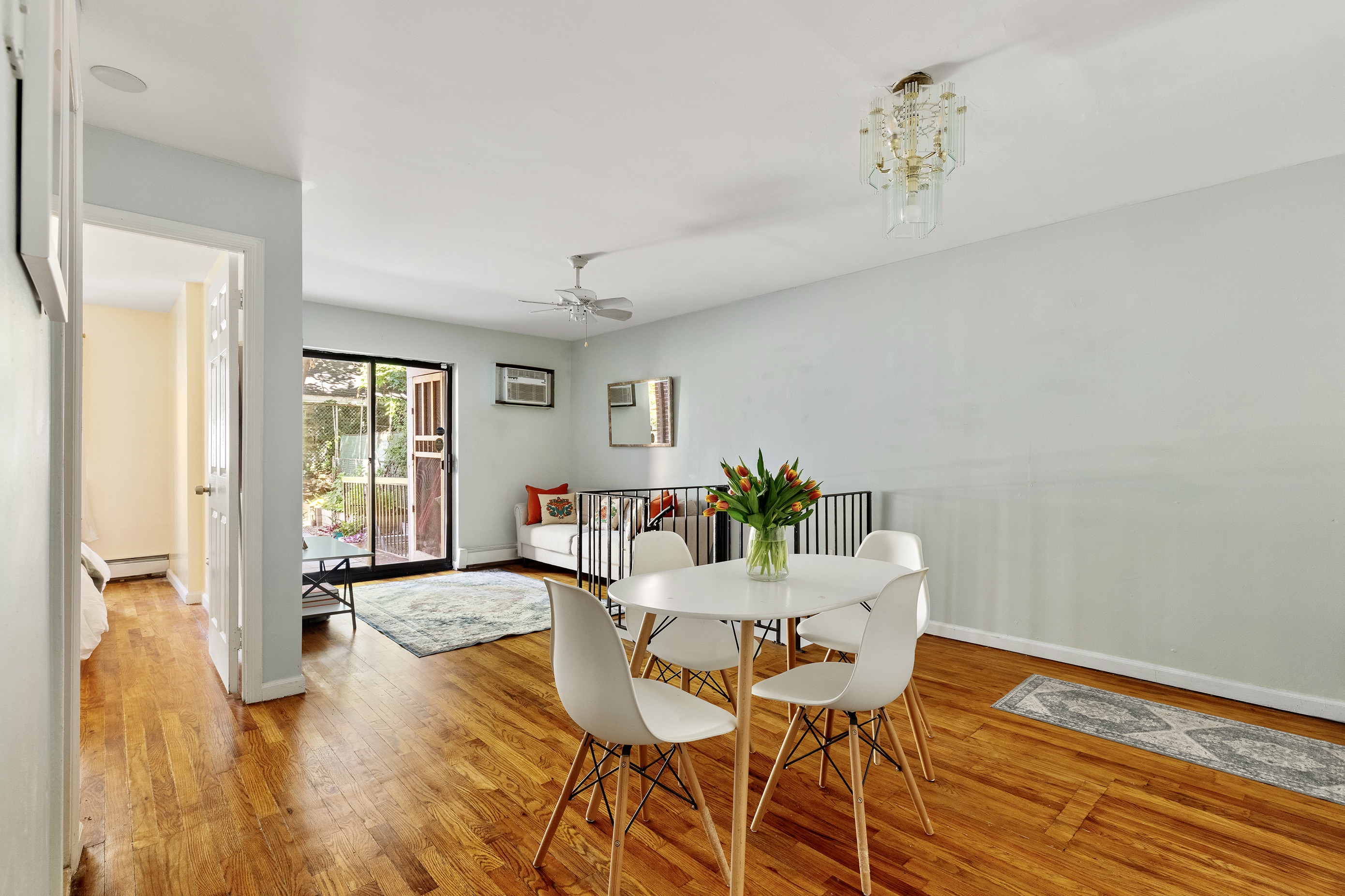 105-09 Otis Avenue, Unit 1B Queens, NY 11368 - Photo 4 of 9 a workspace with furniture and window