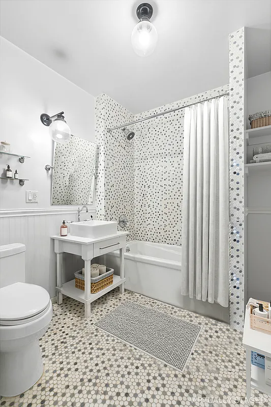 180 Bainbridge Street, Unit 305 Brooklyn, NY 11233 - Photo 5 of 23 a bathroom with a sink a toilet and shower