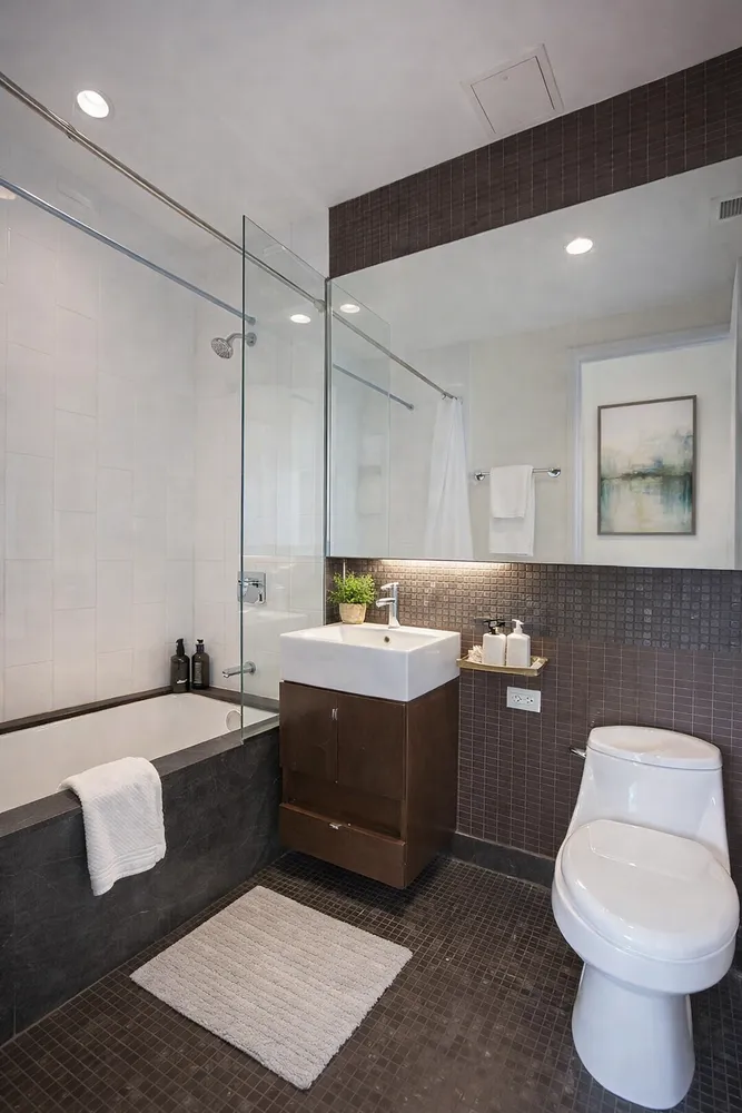 a bathroom with a bathtub sink and toilet