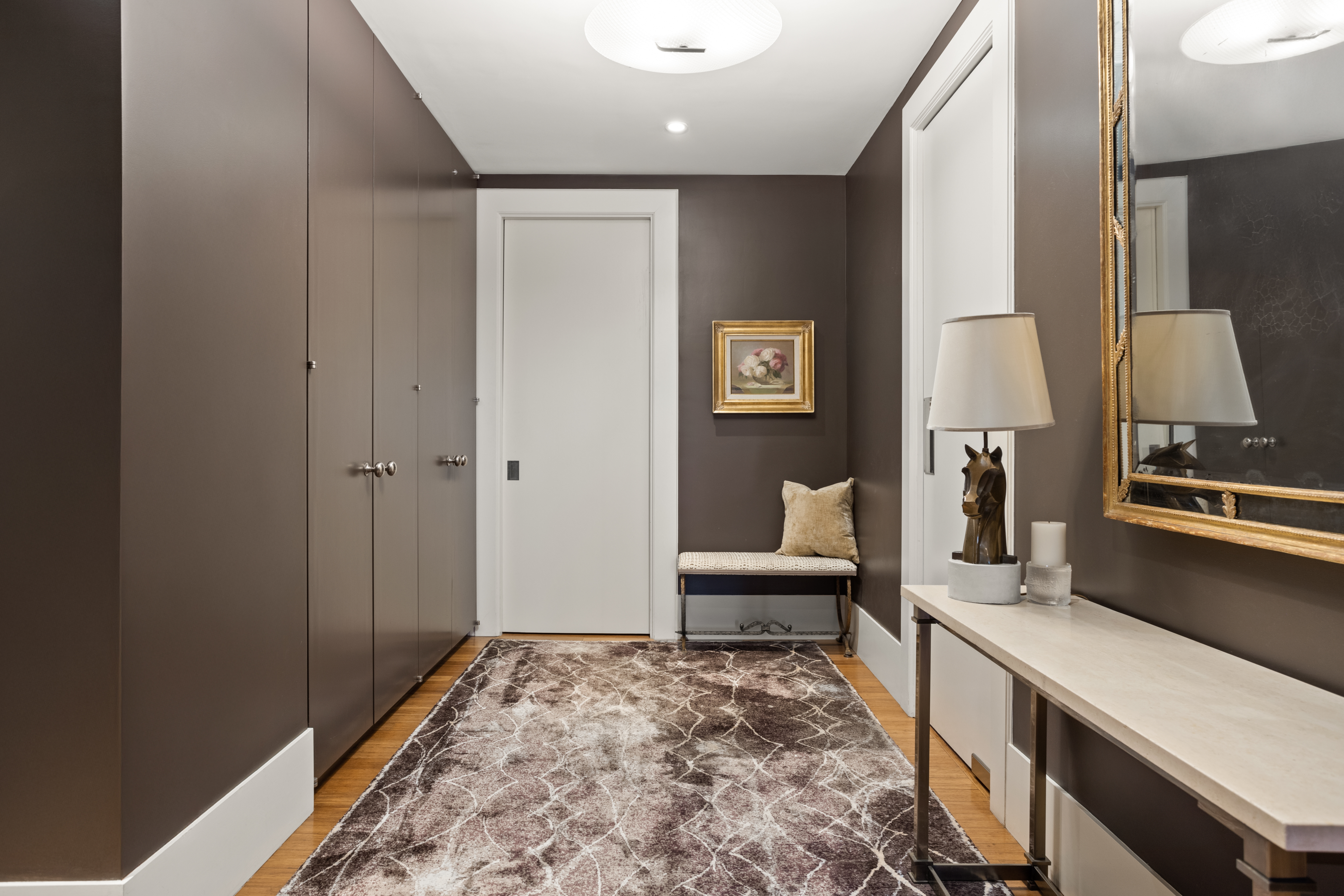 255 East 74th Street, Unit 21AB Manhattan, NY 10021 - Photo 13 of 37 a living room with furniture and a rug