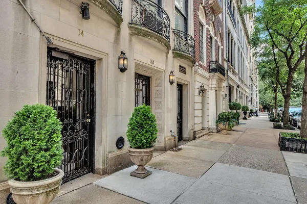 a view of a building with potted plants