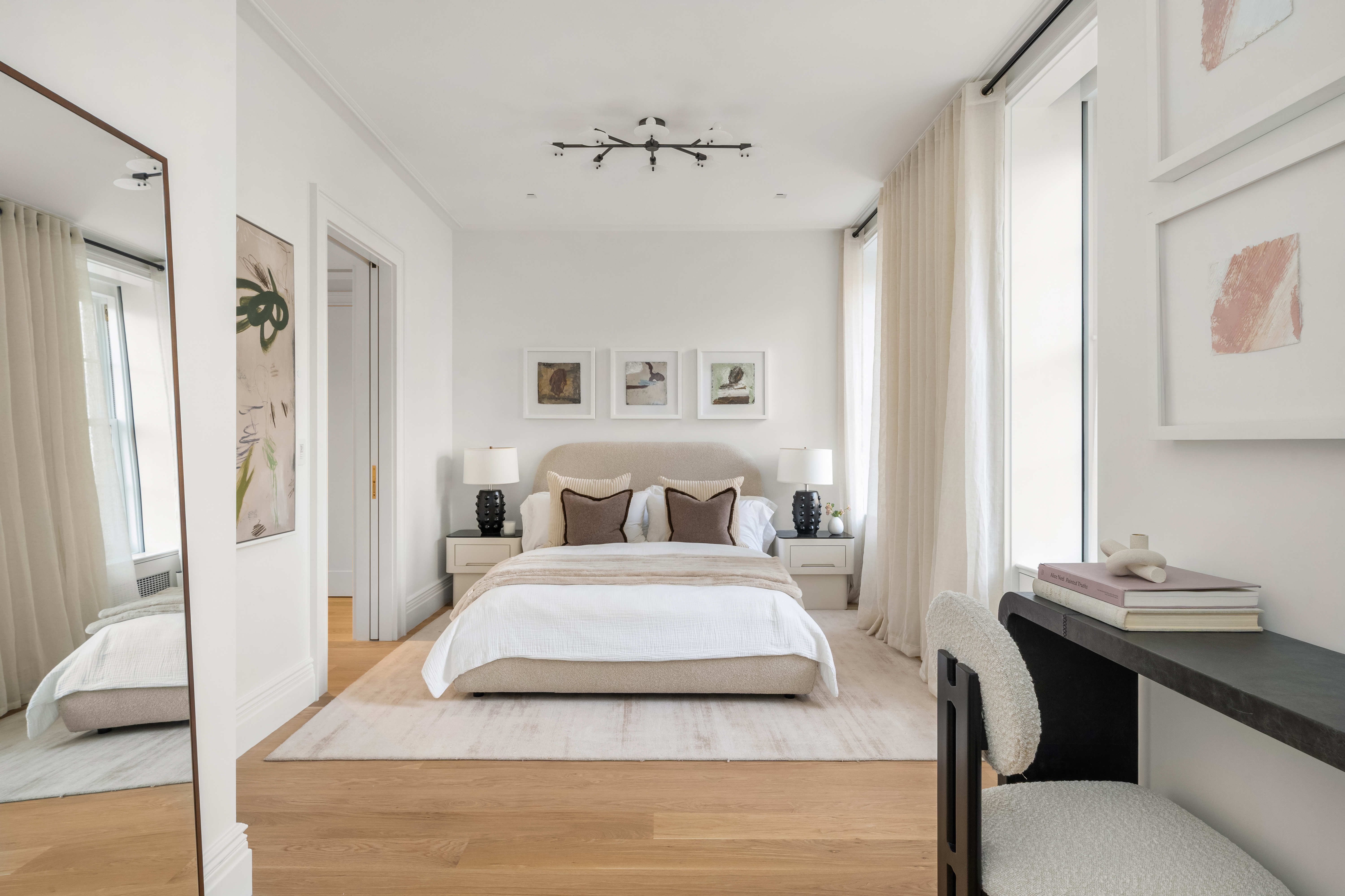 1020 5th Avenue, Unit 9 Manhattan, NY 10028 - Photo 21 of 27 a bedroom with a bed and wooden floor