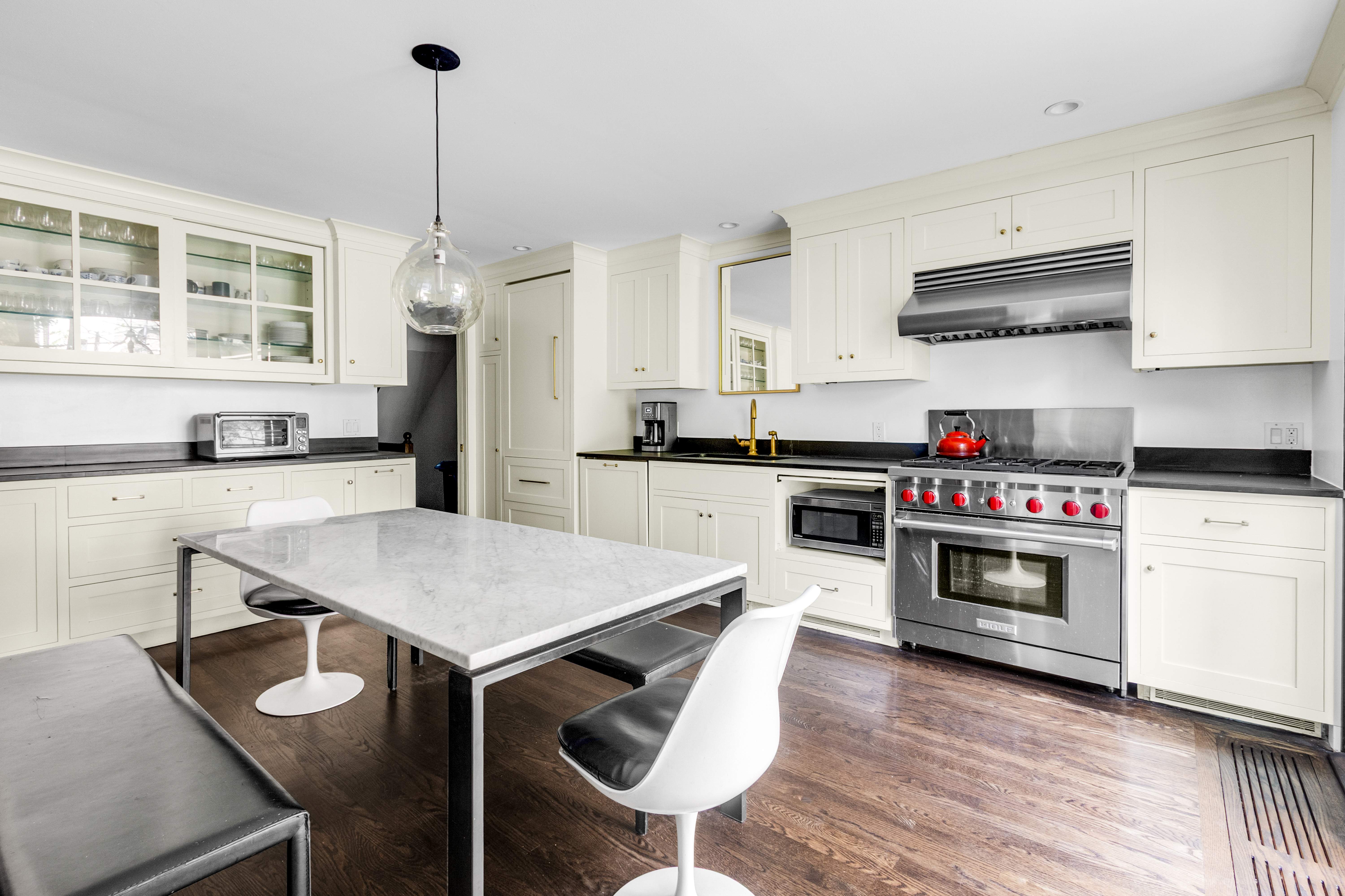 125 West 132nd Street Manhattan, NY 10027 - Photo 5 of 21 a kitchen with stainless steel appliances a stove a sink and a refrigerator