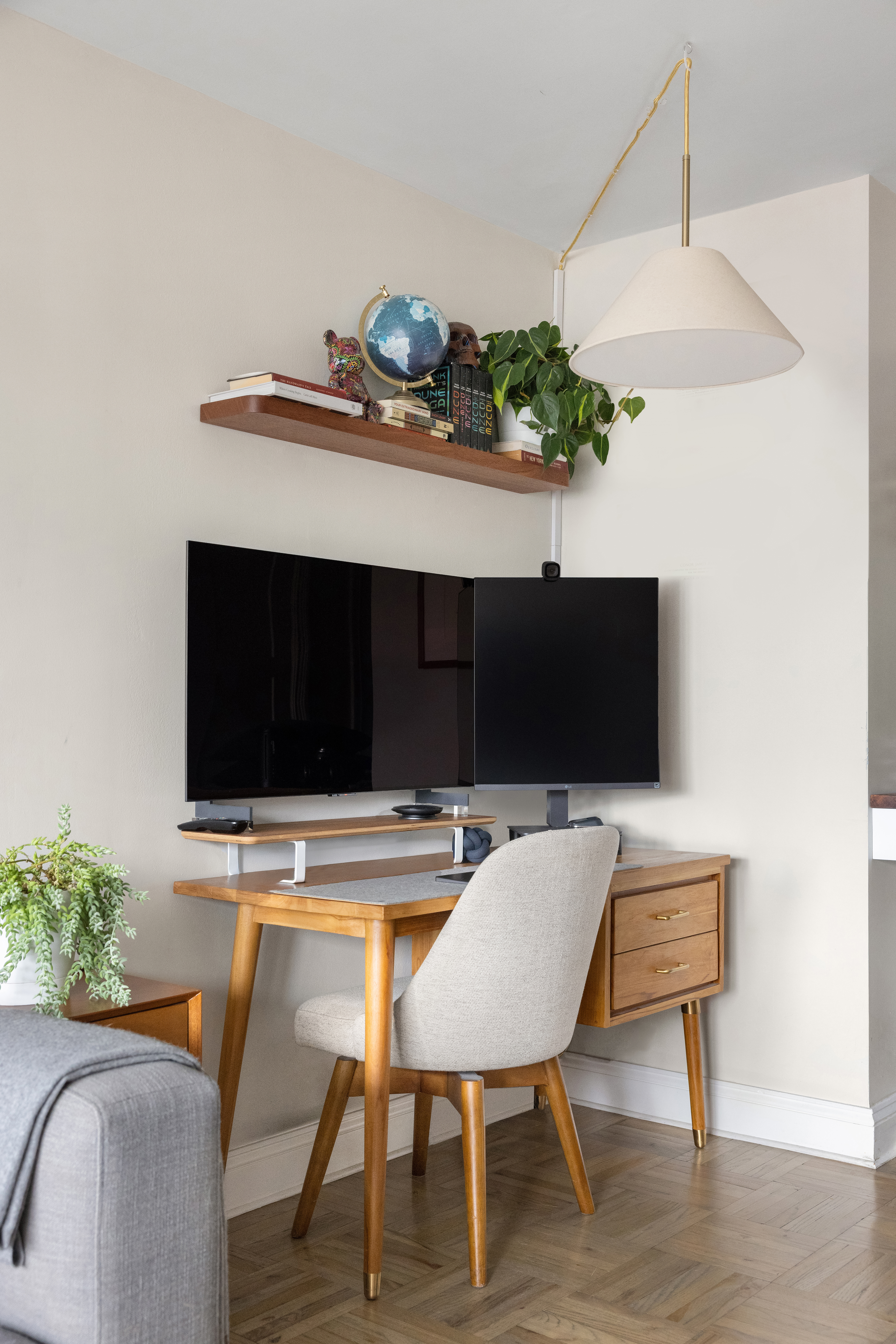 2 Charlton Street, Unit 10F Manhattan, NY 10014 - Photo 5 of 13 a living room with furniture and a potted plant