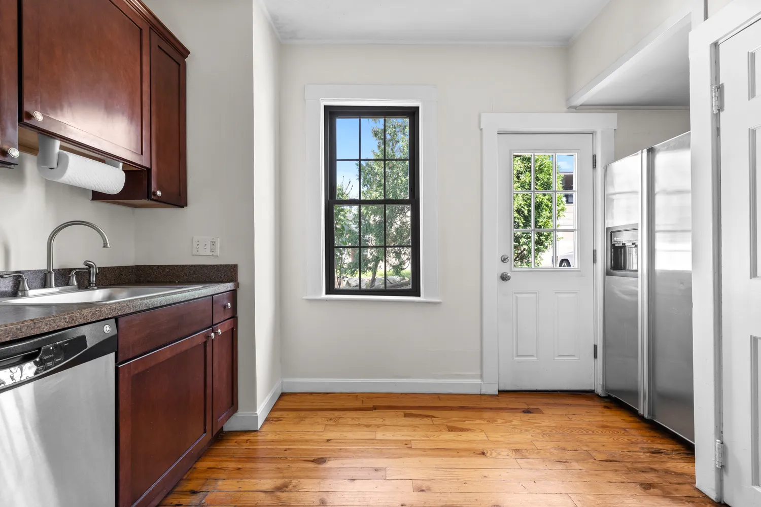 a view of a kitchen with a sink and windows