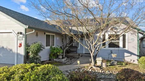 a front view of a house with garden