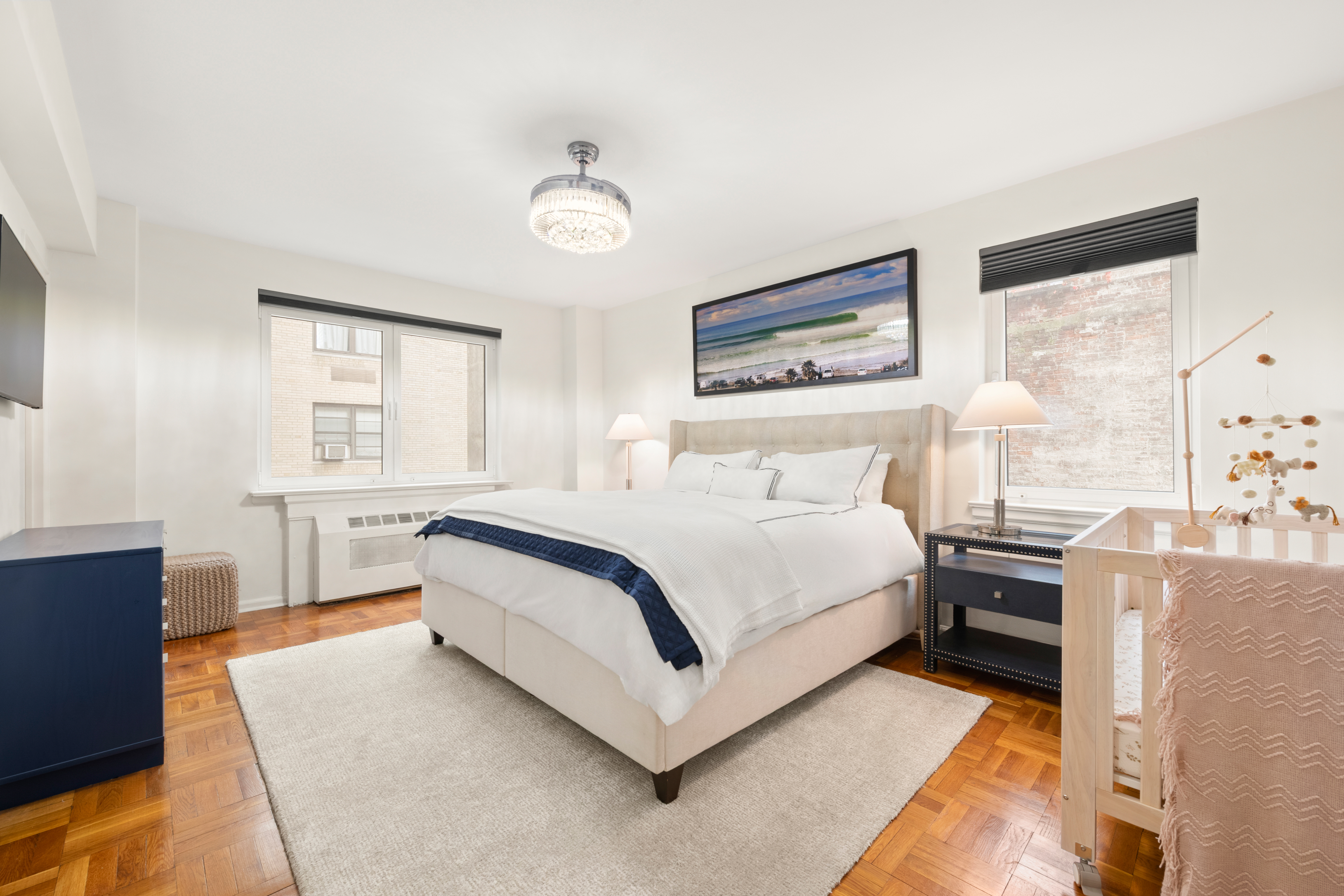 860 5th Avenue, Unit 5L Manhattan, NY 10065 - Photo 4 of 12 a bedroom with a bed and window