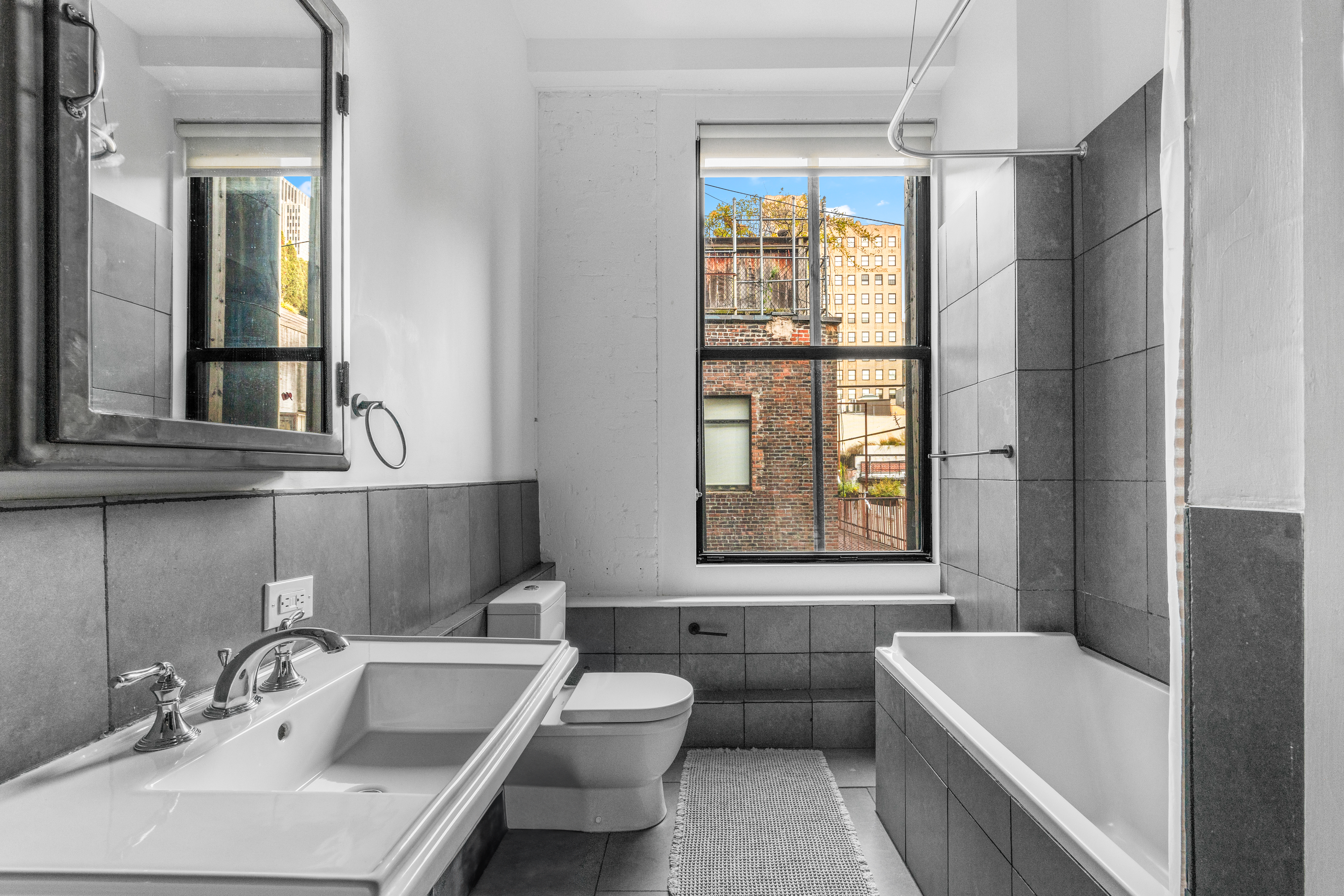 5 White Street, Unit 5B Manhattan, NY 10013 - Photo 14 of 21 a bathroom with a sink and a bathtub