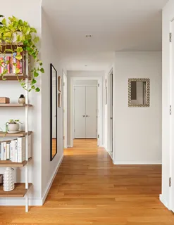 a view of a room with wooden floor and closet