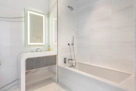 a bathroom with a bathtub and a sink