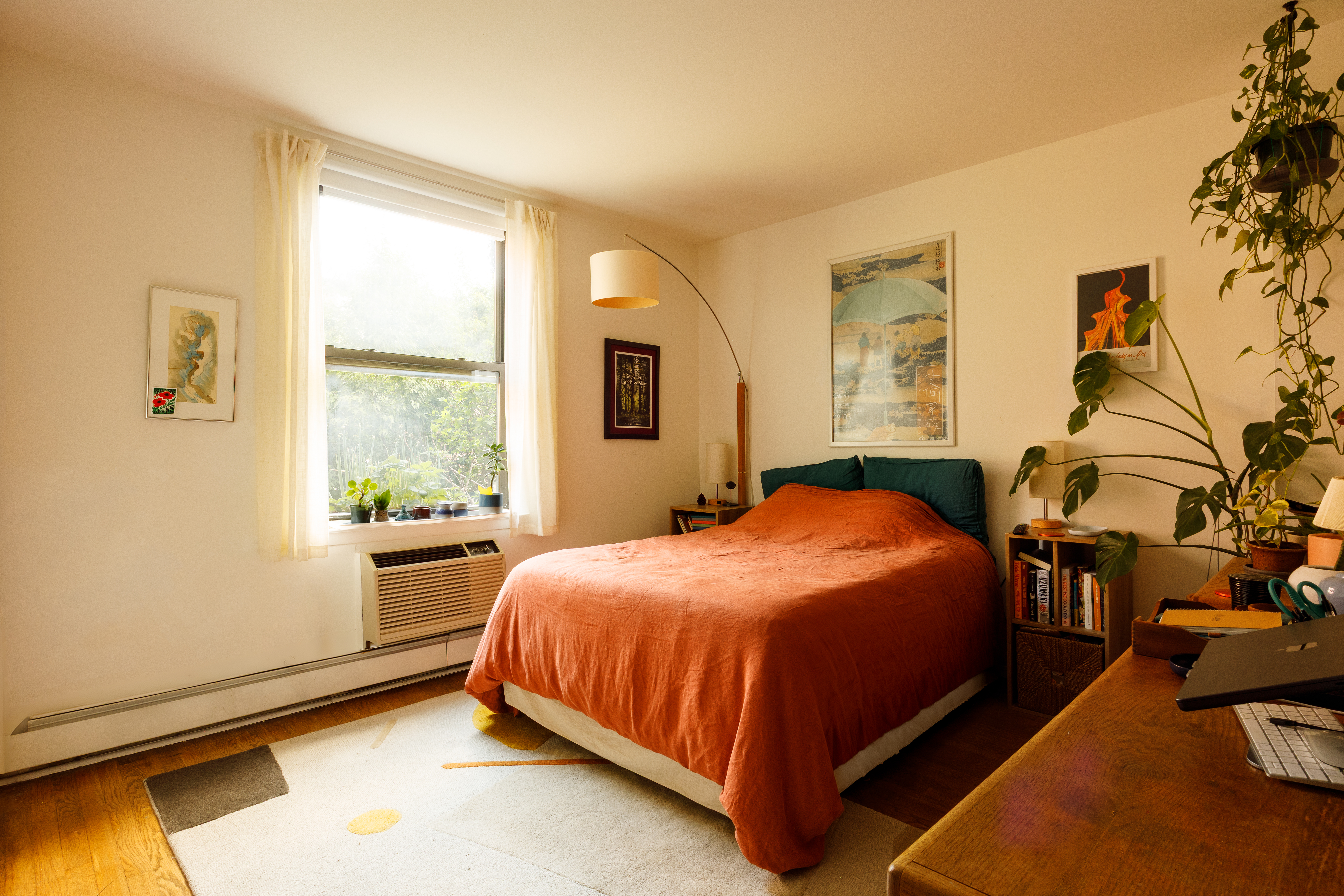211 Berry Street, Unit 2 Brooklyn, NY 11249 - Photo 4 of 7 a bed sitting in a bedroom next to a window