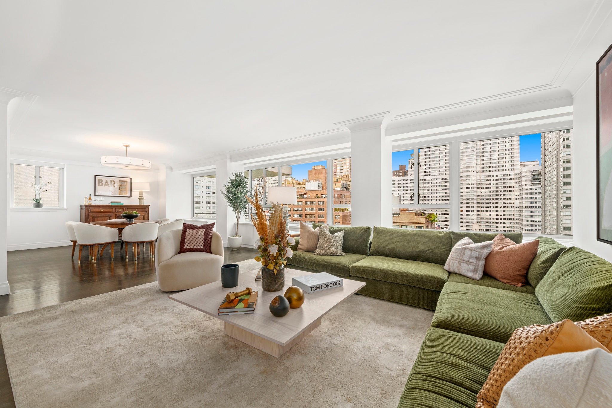 200 East 66th Street, Unit D1205 Manhattan, NY 10065 - Photo 2 of 33 a living room with furniture and a large window
