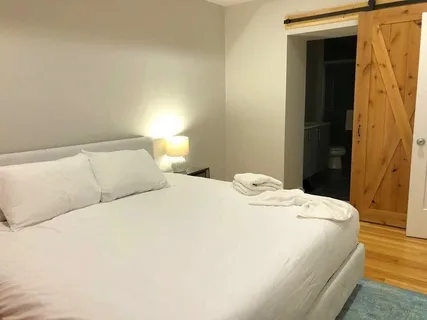 a bedroom with a bed and a mirror