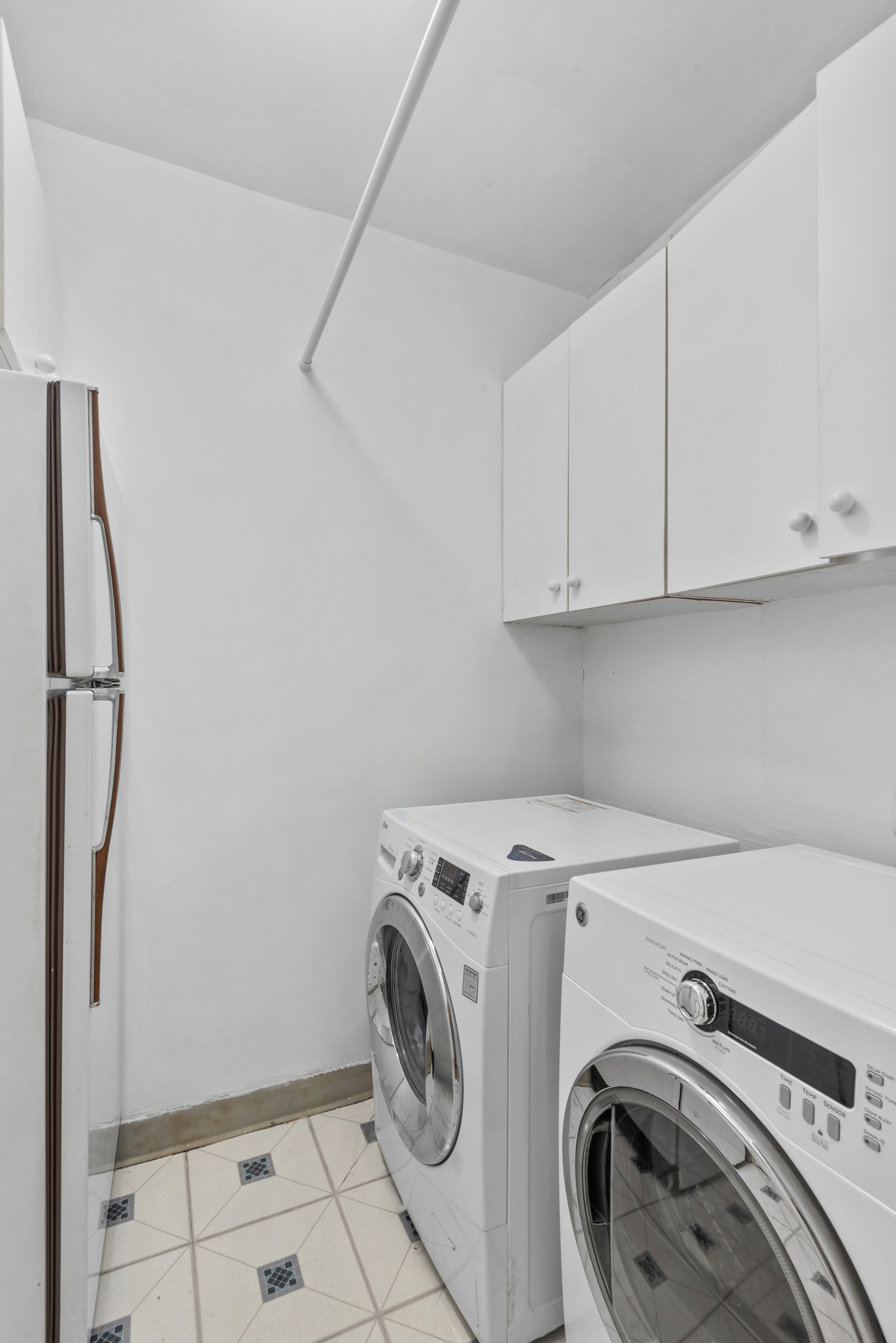 101 West 12th Street, Unit 6MN Manhattan, NY 10011 - Photo 7 of 17 a utility room with dryer and washer